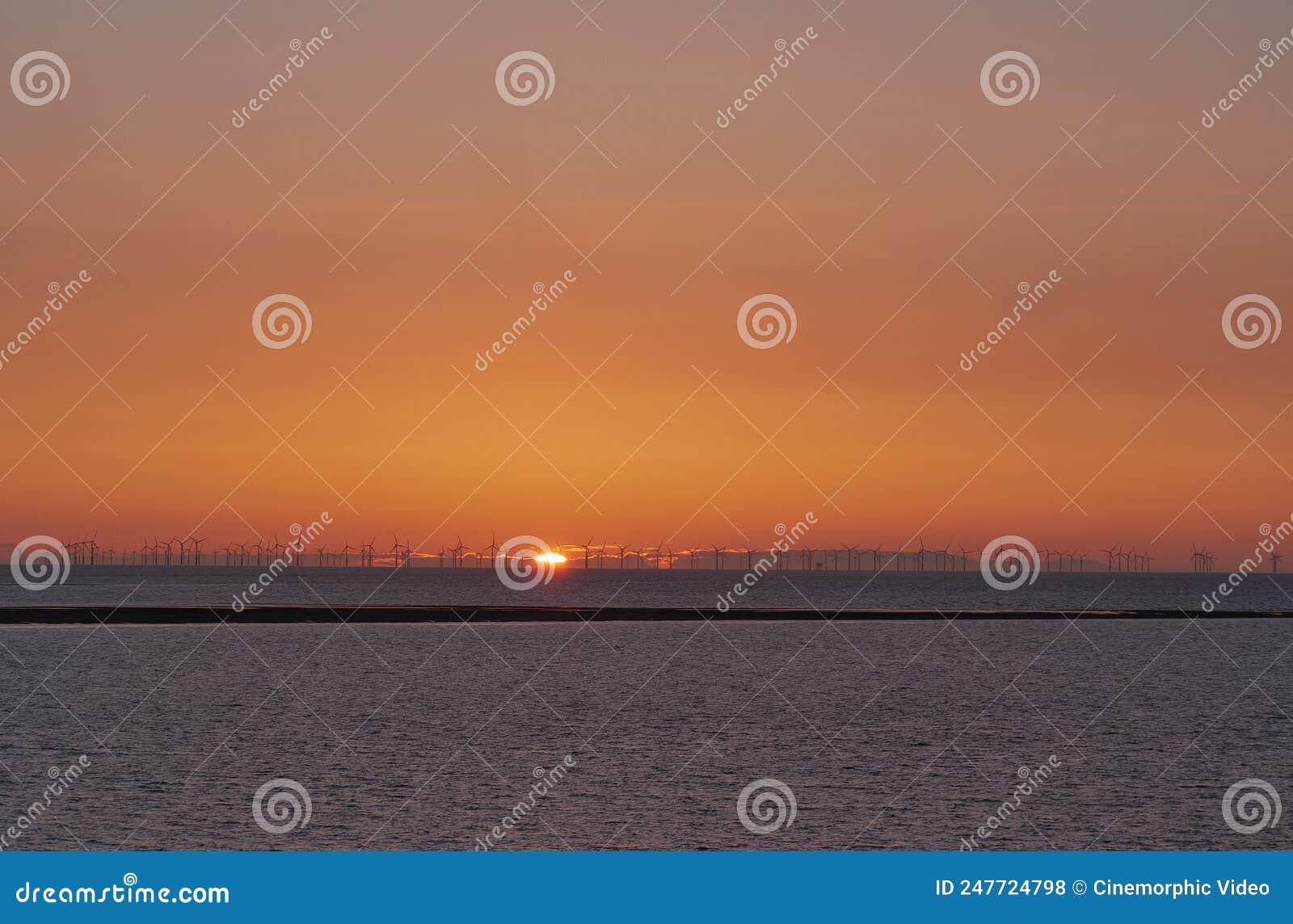 Hilbre Island Sunset with Windmills Stock Photo Image of coast, cloud