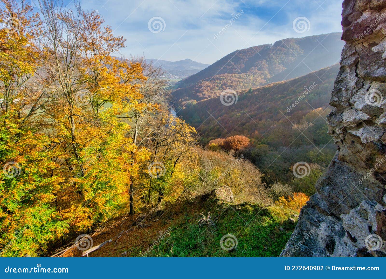 view from hrad sasov castle ruins towards hron river during autumn