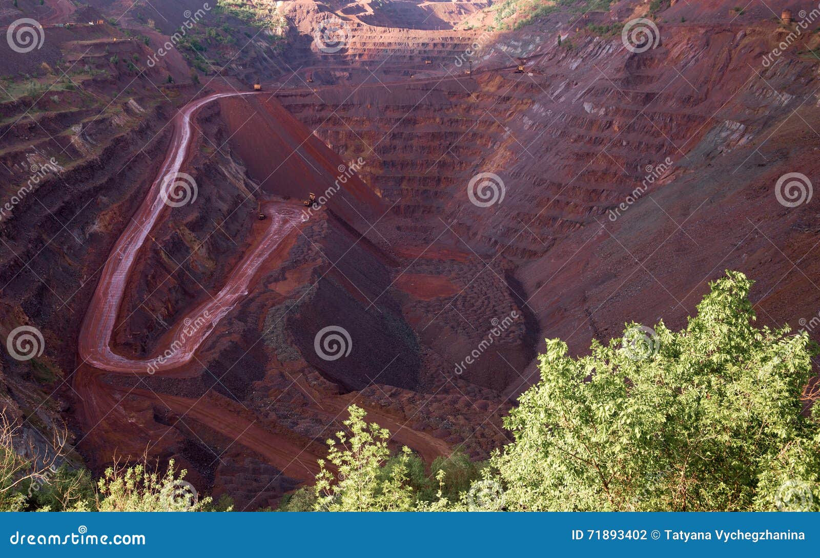 view inside the iron oxid quarry with trails on slopes