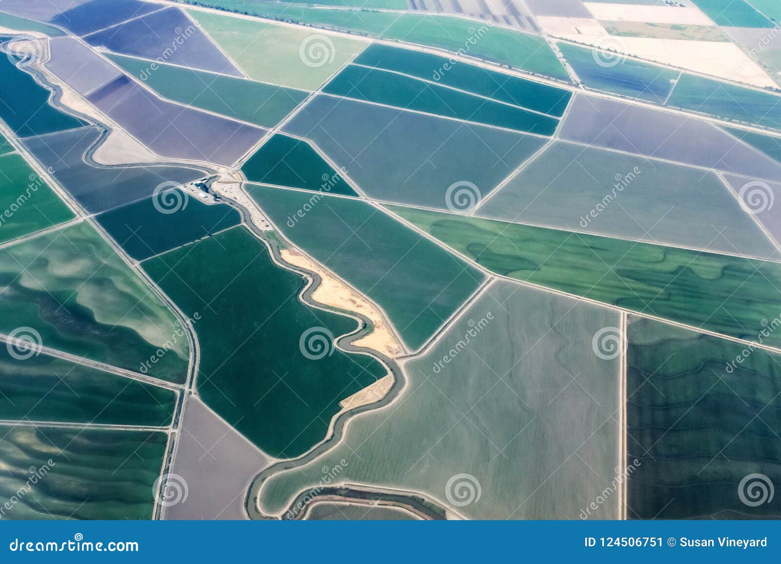 view of irrigated farmland from the sky - getting ready to land in sacramento california airport