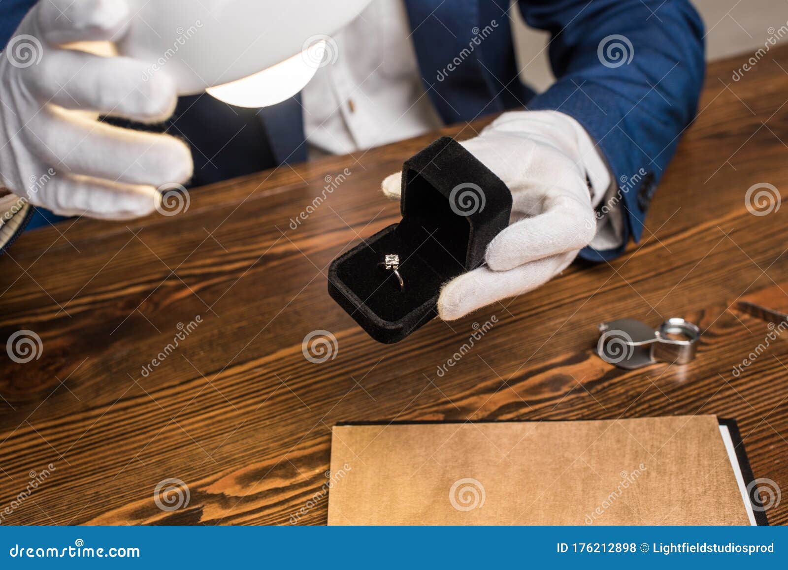 View Of Jewelry Appraiser Holding Ring Stock Photo - Image ...