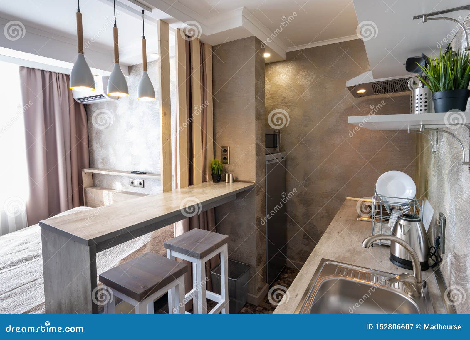 View of the Kitchen and Bar in a Small Hotel Room Studio Stock Image