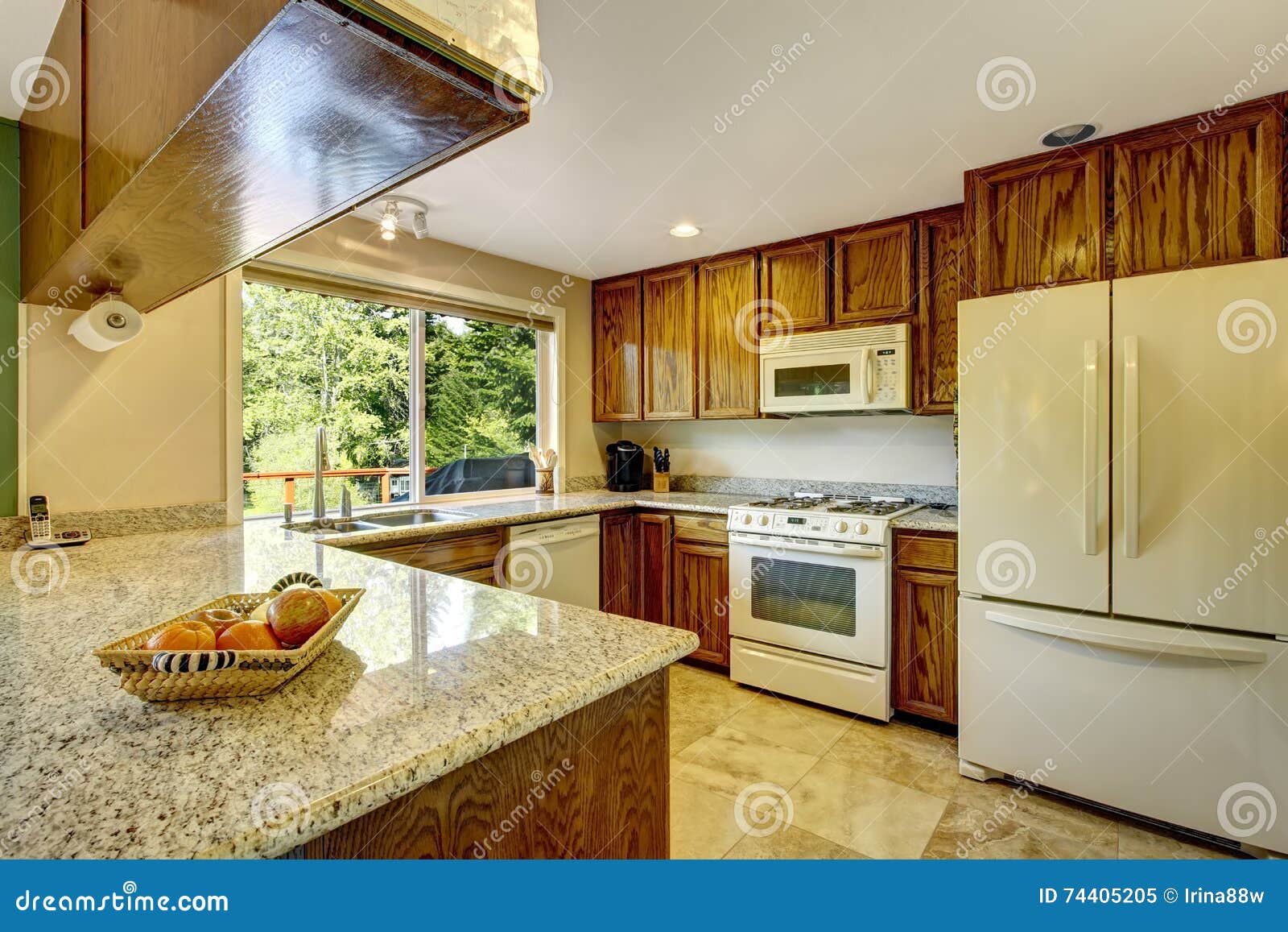 View Of Kitchen Room With Hardwood Cabinets And Tile Flooring