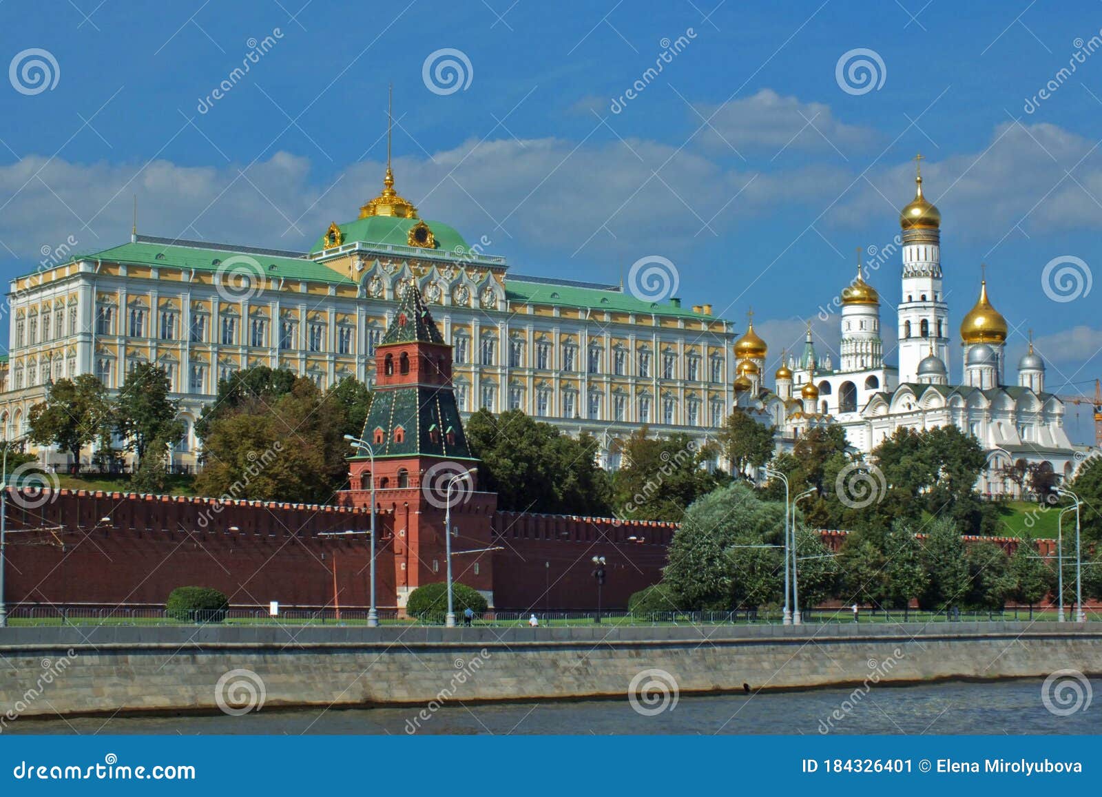 view of kremlin wall with towers and cathedrals photo made from opposite bank of the river moscow