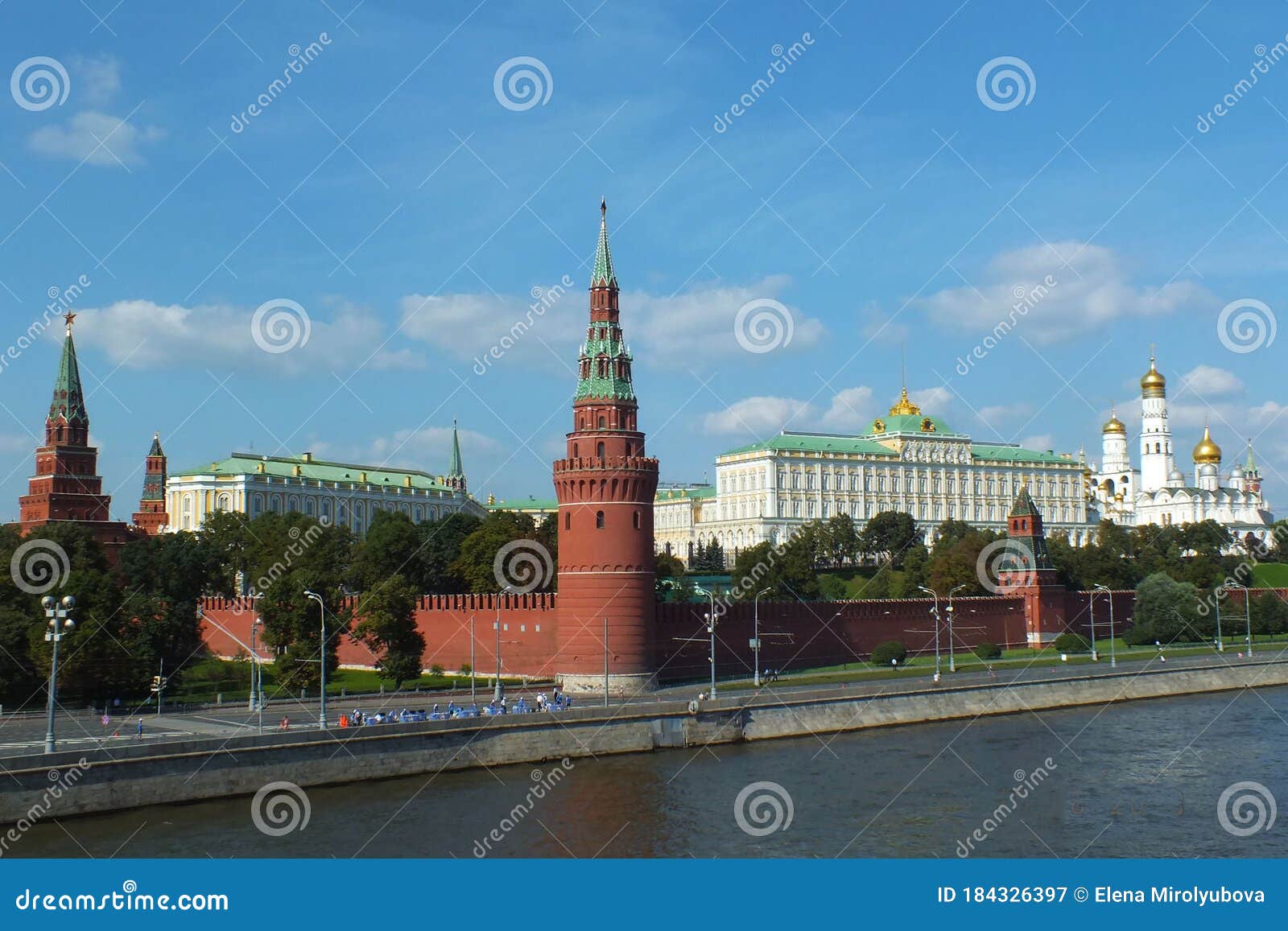 view of kremlin wall with towers and cathedrals photo made from opposite bank of the river moscow
