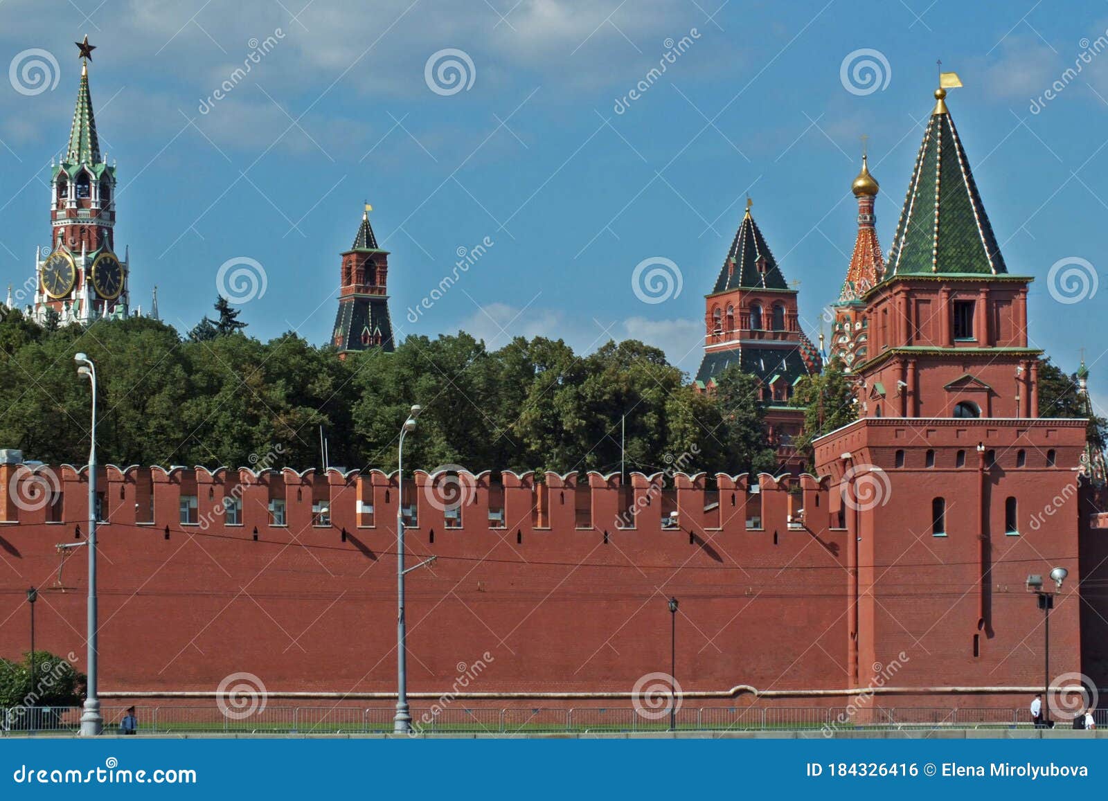 view of kremlin wall with towers and clock tower moscow