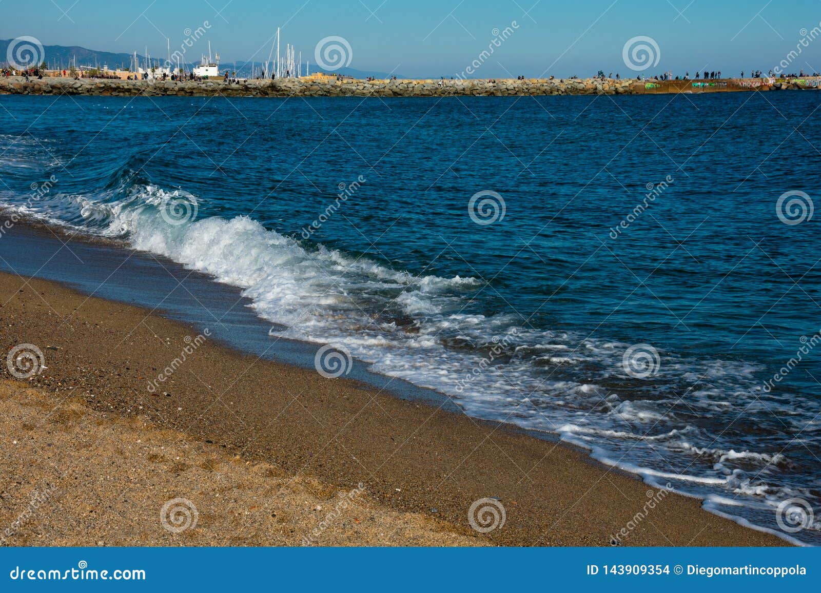 view of la barceloneta beach on a sunny and hot winter day