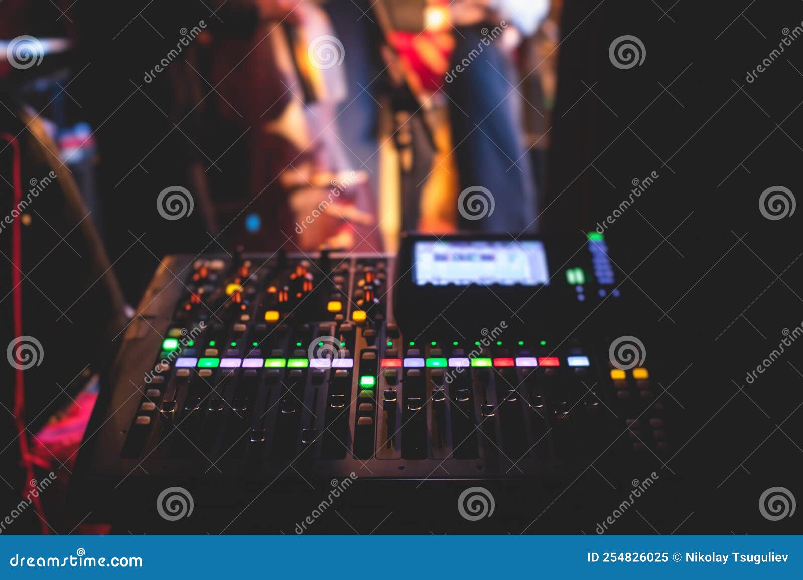 View of Lighting Technician Operator Working on Mixing Console