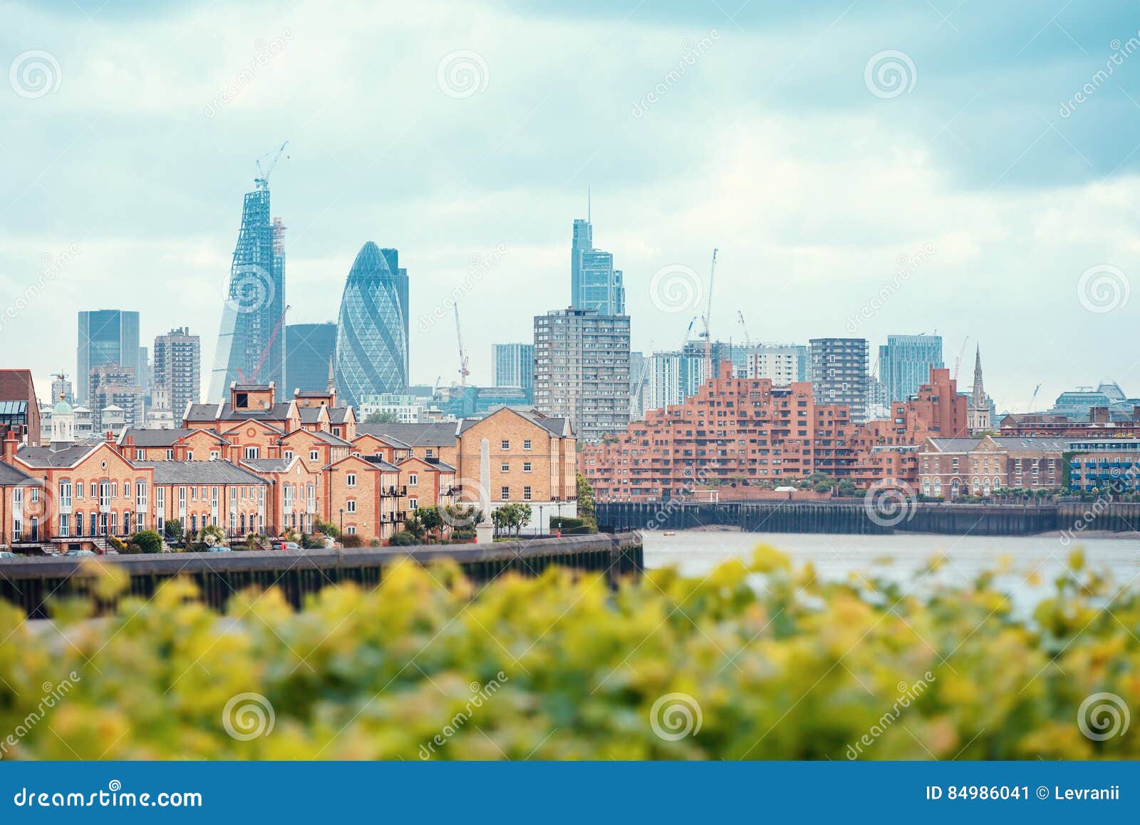 view of london docklands with the thames river, downtown, cucumber and city center