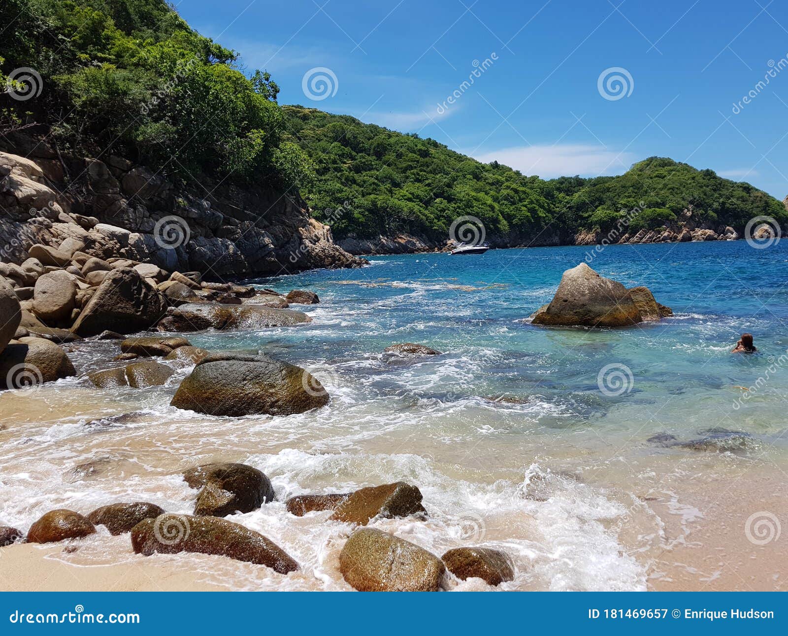 view of lovers` beach, sand rocks and waves on roqueta island