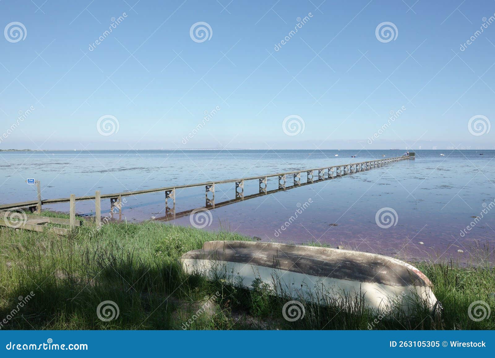 View of Low Tide and an Old Boat on the Grass Stock Image Image of