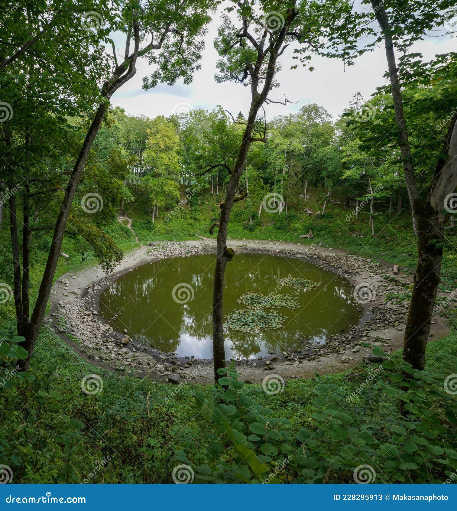 view of the meteor crater at kaali lake on saaremaa island in estonia