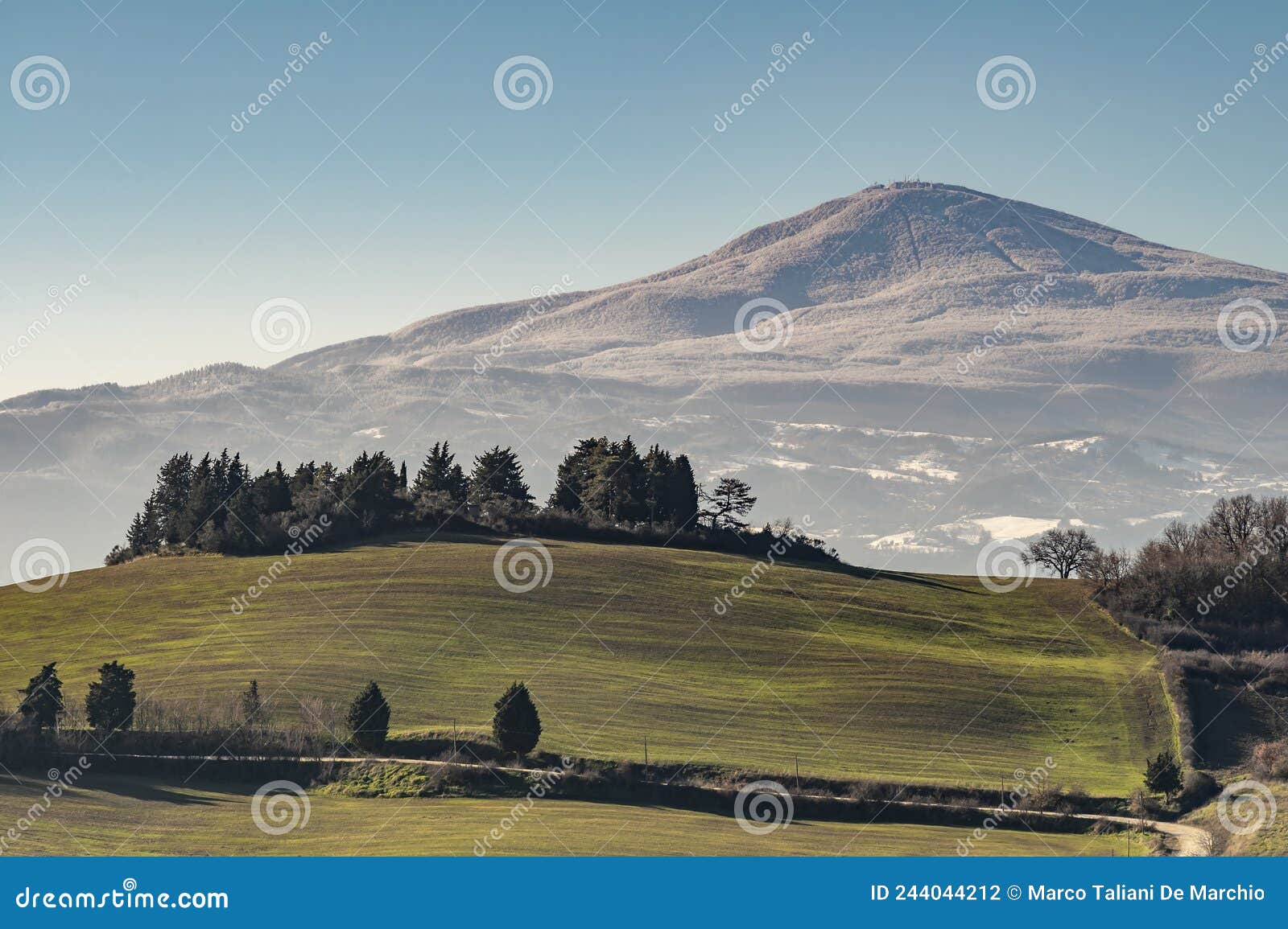 view of monte amiata covered by snow from the monticchiello area, siena, italy