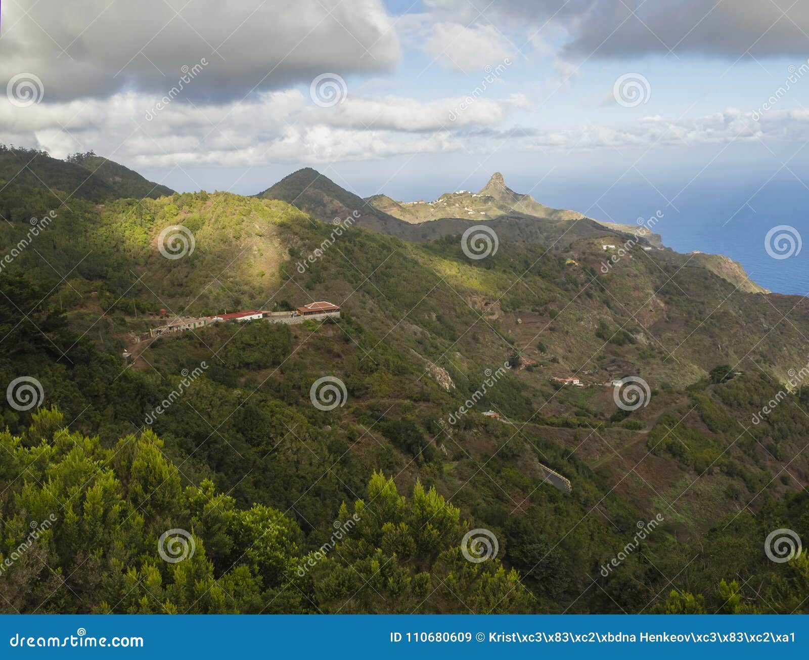 view on monte taborno with green hills, houses and blue sky whit