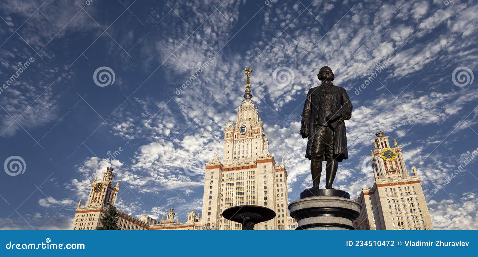 view of the monument to mikhail vasilyevich lomonosov from building of moscow state university msu, on the background of the sky,