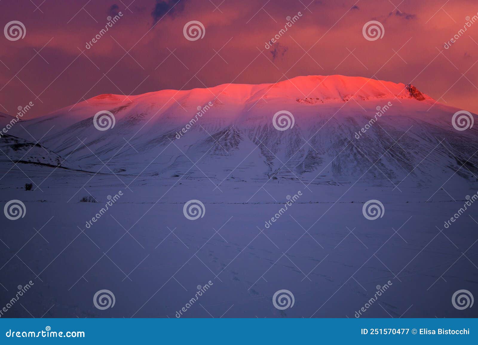 view of mount vettore during winter sunset in umbria