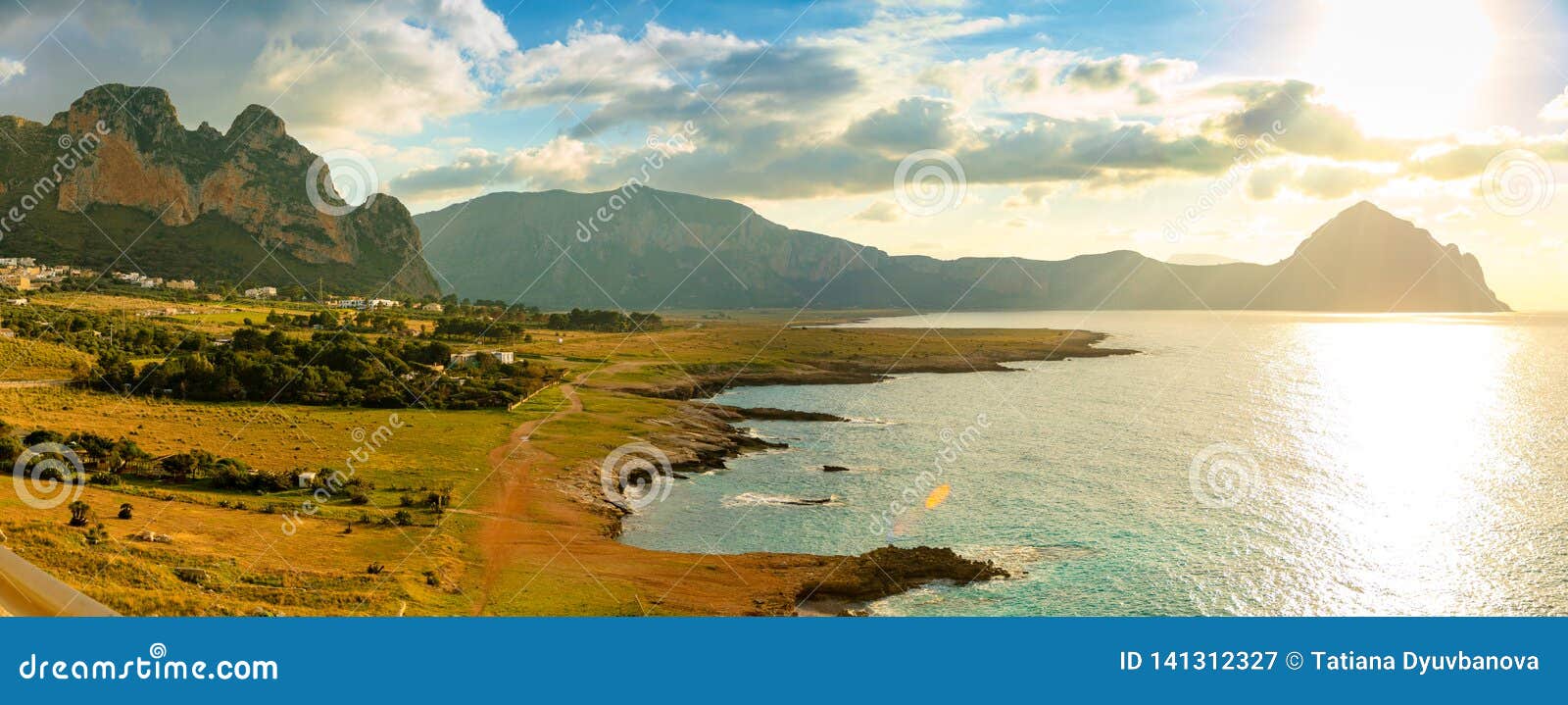 view of mountains and blue sea in the italian natural reserve or riserva dello zingaro at sunset lights in sicily, italy