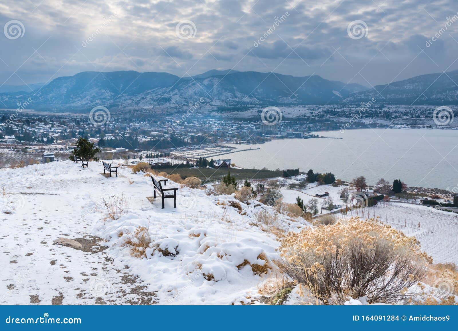 winter view of penticton covered in snow with view of okanagan lake and mountains
