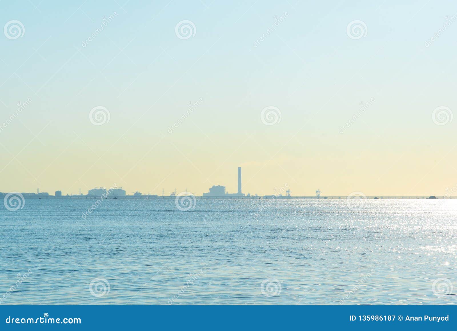 view of nam rin beach and refinery rayong,thailand