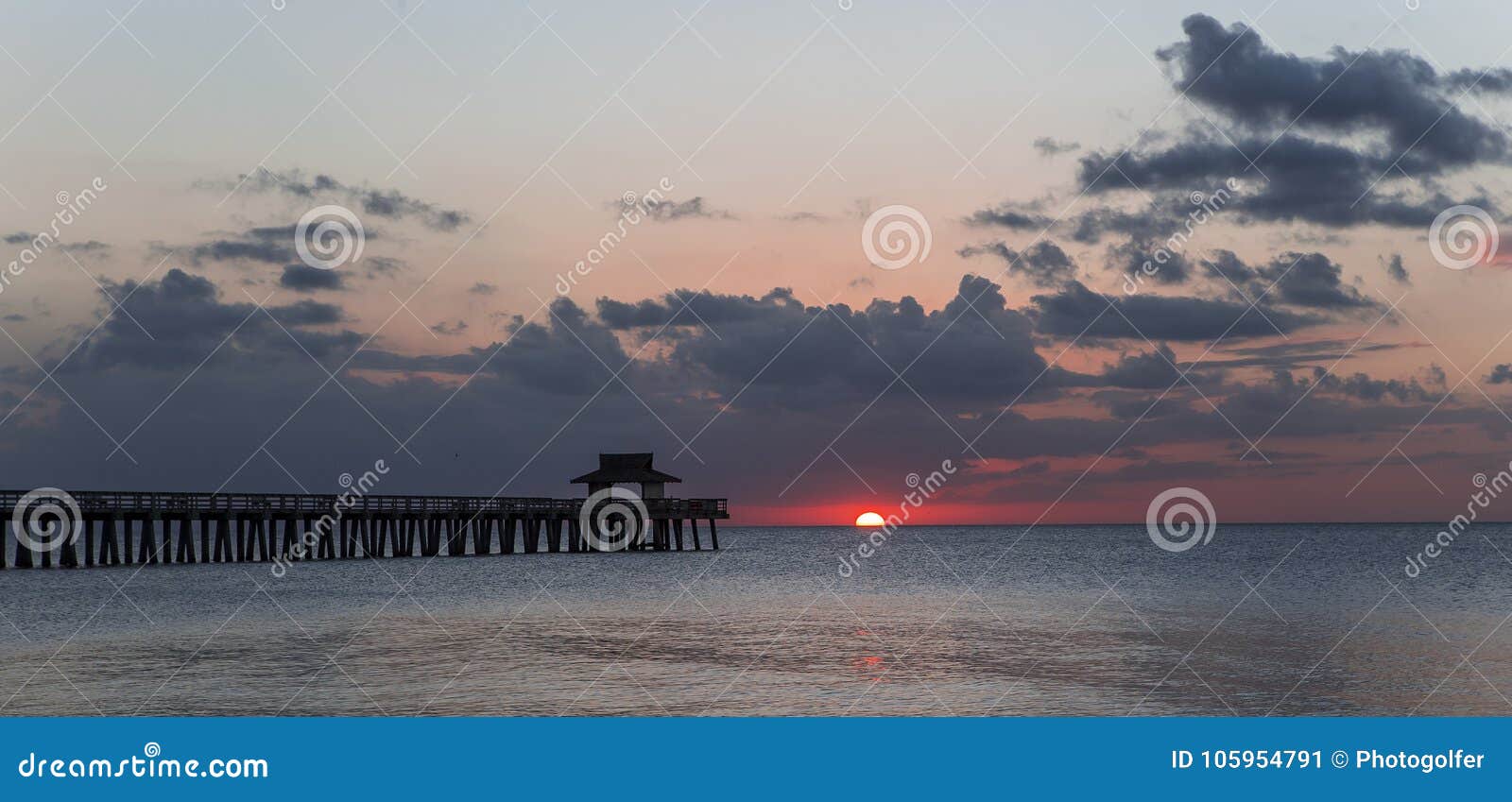 pier jetty at sunset in naples, forida, usa