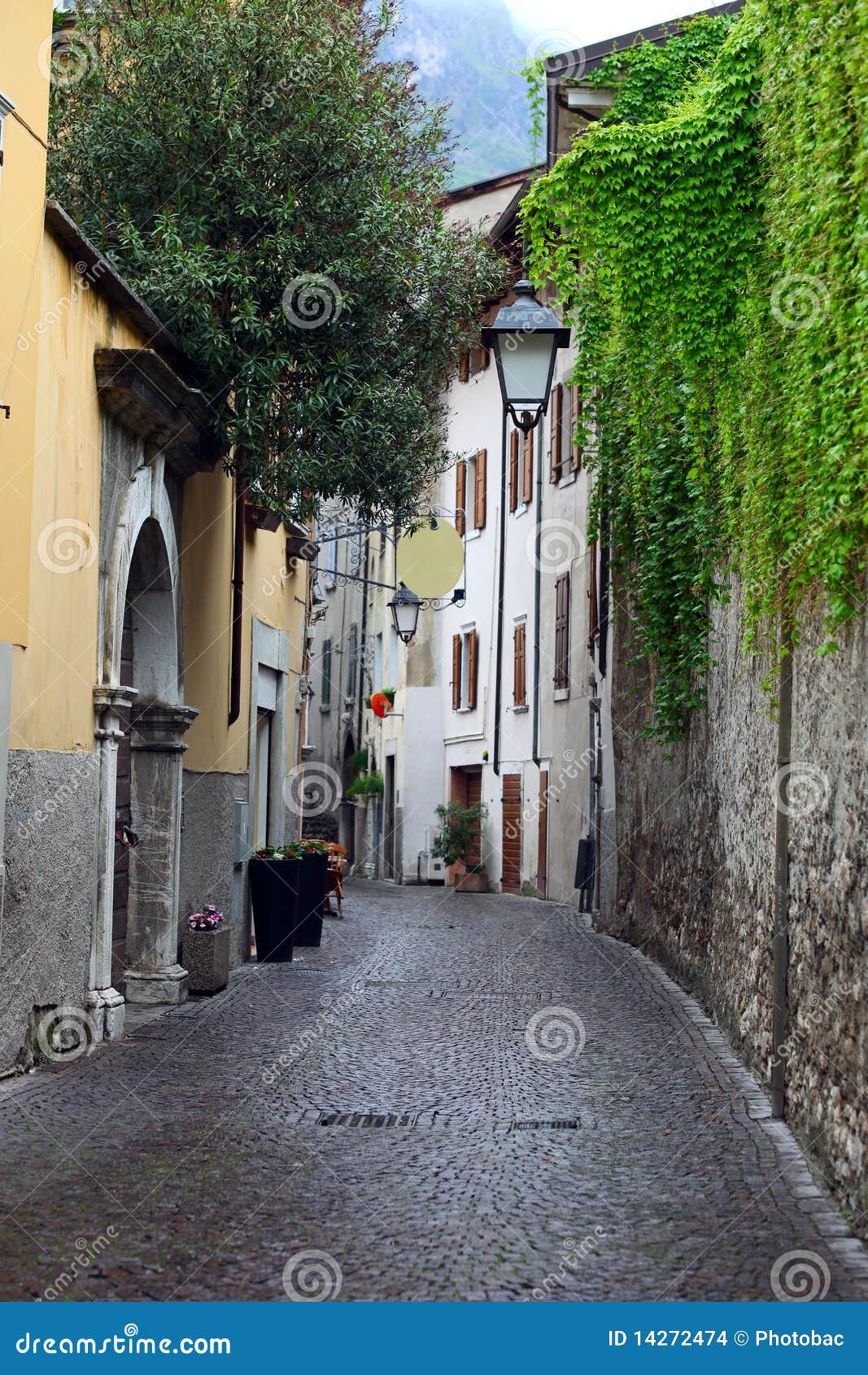 view of a narrow street in arco, north italy