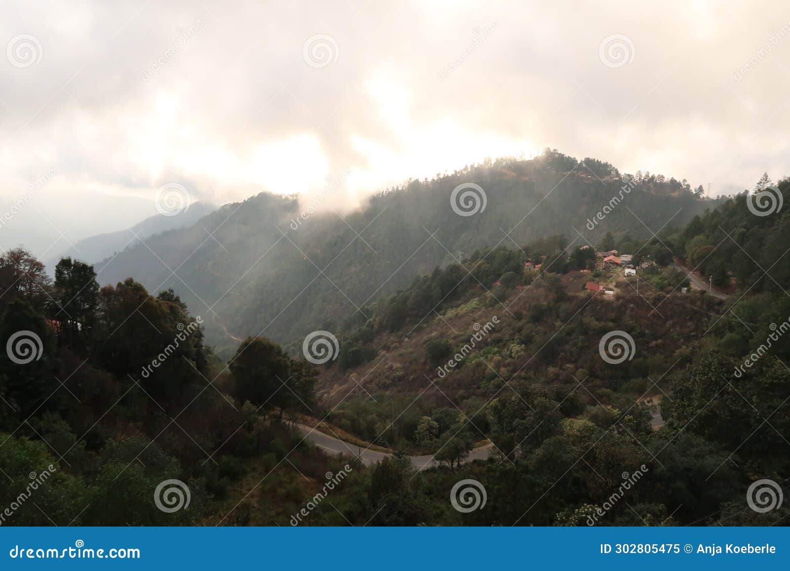 view onto the hills around san jose del pacifico before sunset when fog is coming up, oaxaca, mexico