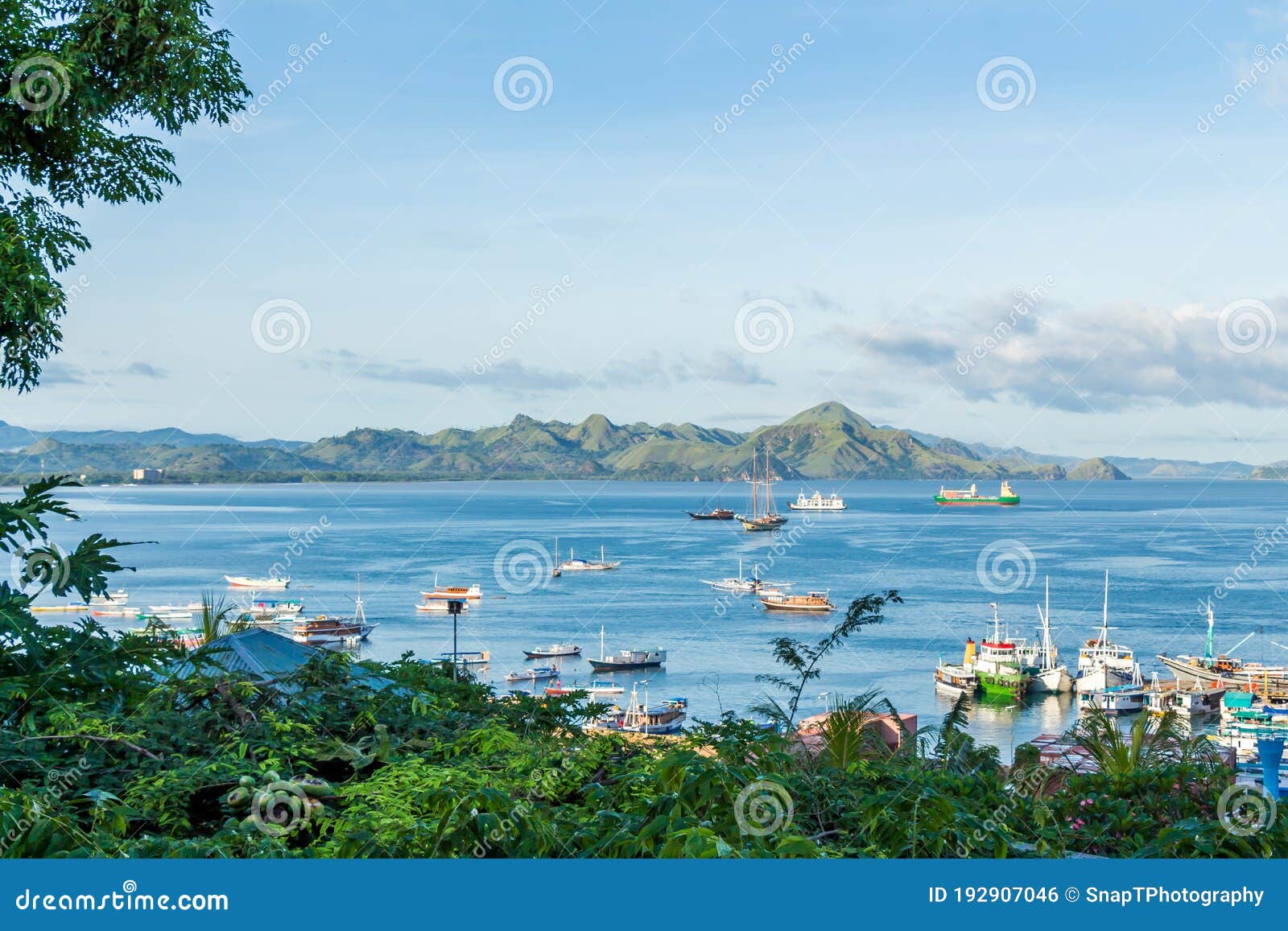 a view over labuan bajo harbour and palua karawo in early morning, indonesia