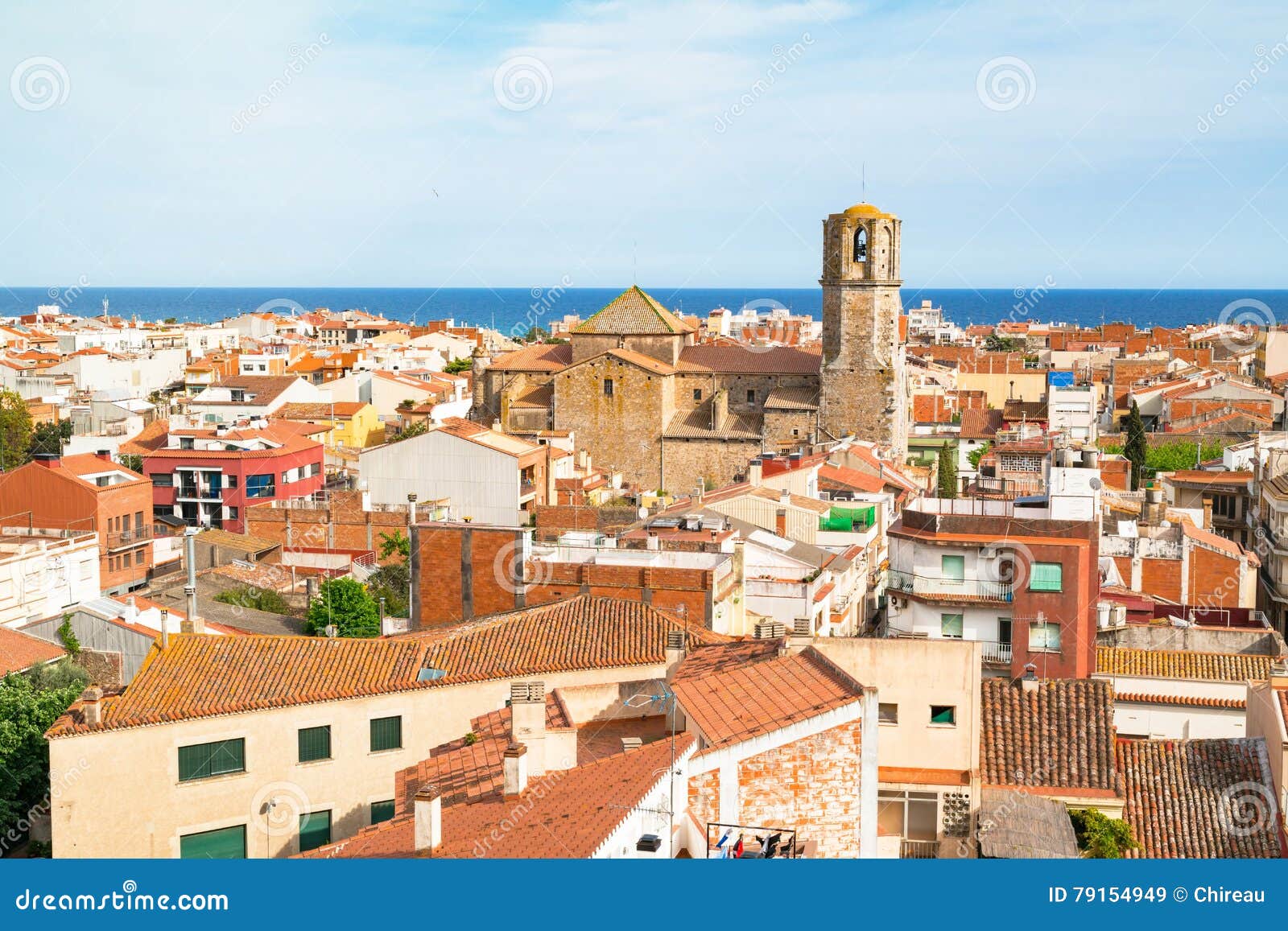 view over the roofs of old town malgrat de mar spain from the hill with mediterranean sea in the background