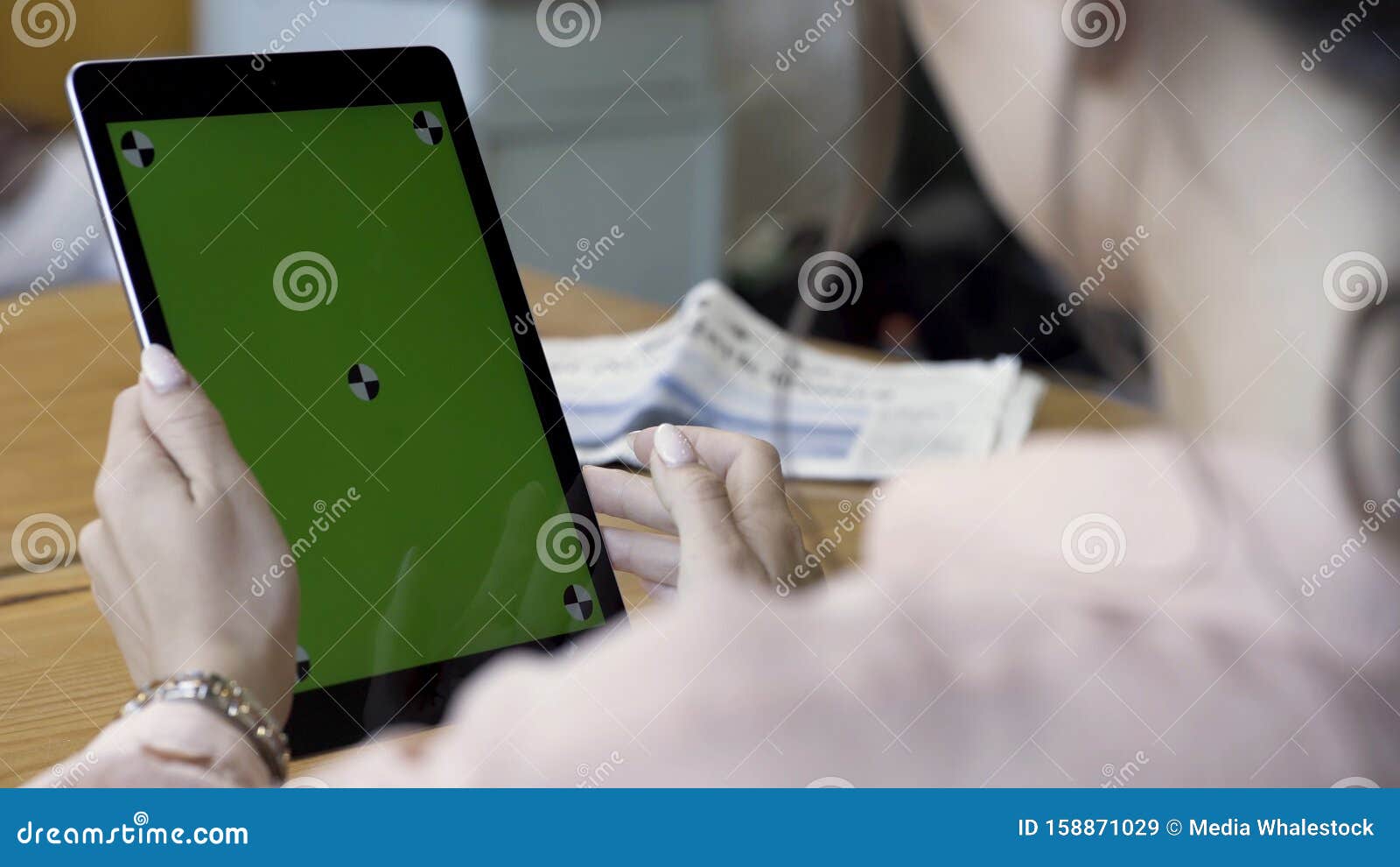 View Over the Shoulder on the Woman Taping on a Tablet Device with ...