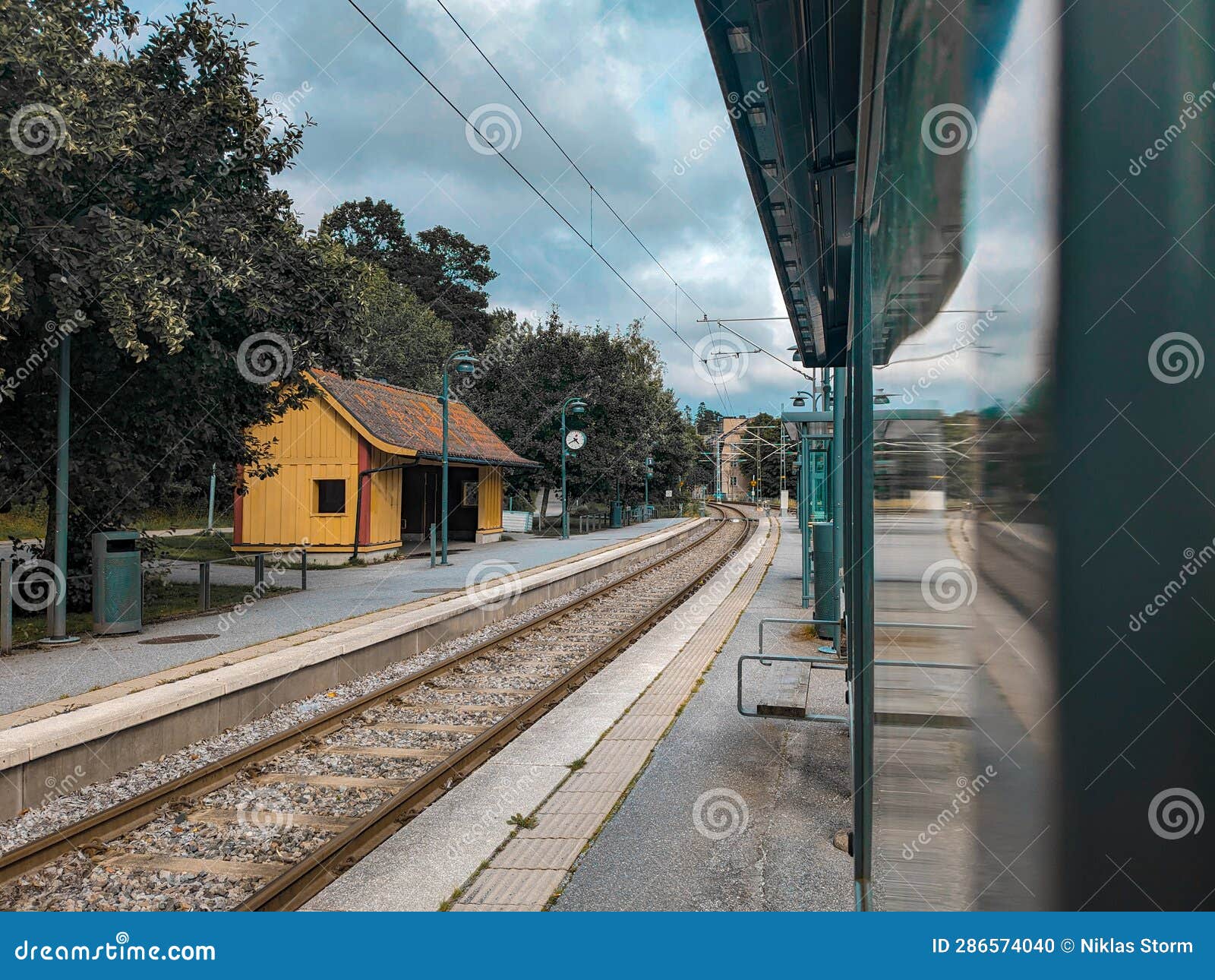 view of railroad station against cloudy sky
