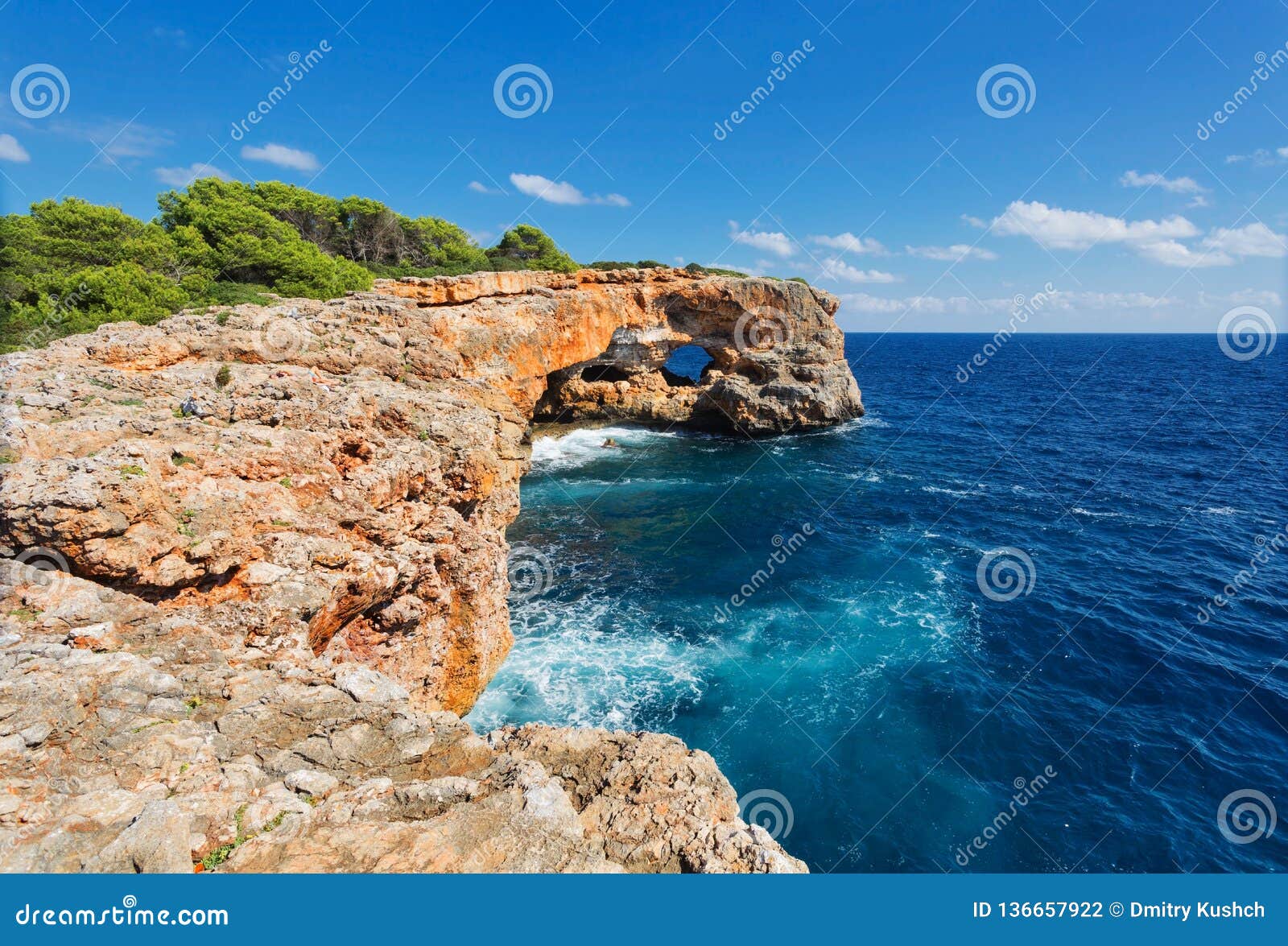 view on rocks with hole and deep blue sea.mallorca island, spain