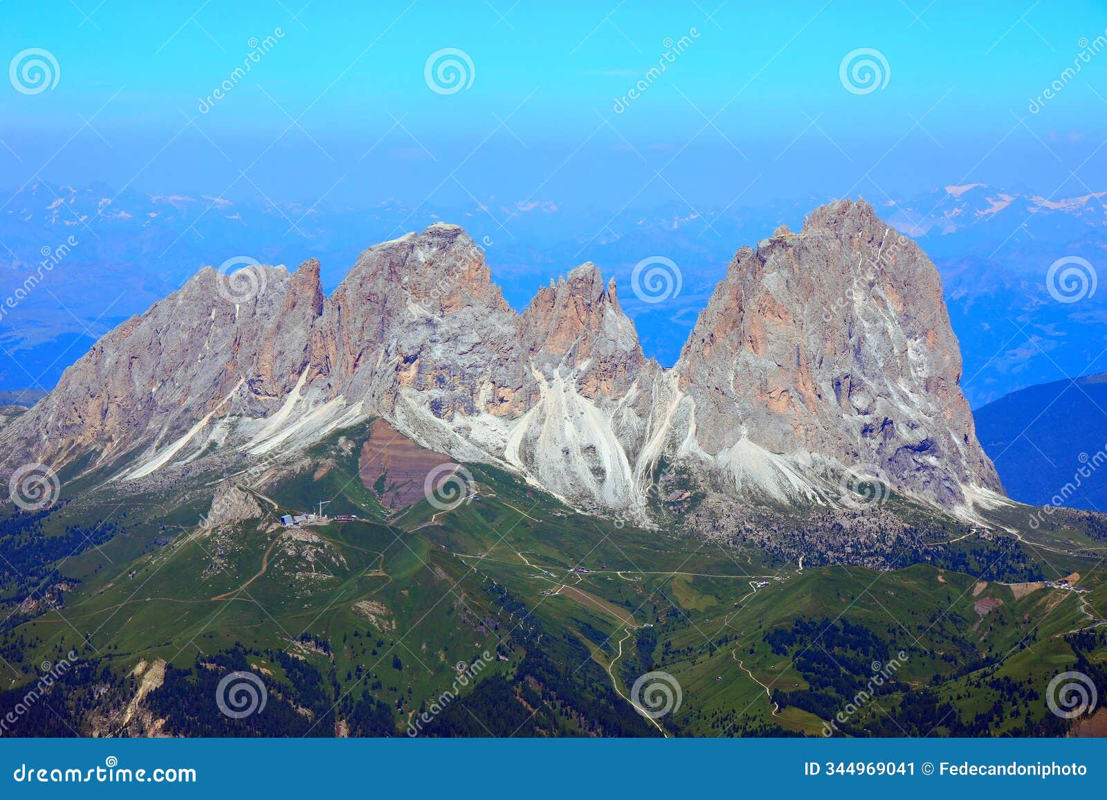 view of the sassolungo mountain group from mount marmolada on a beautiful summer day