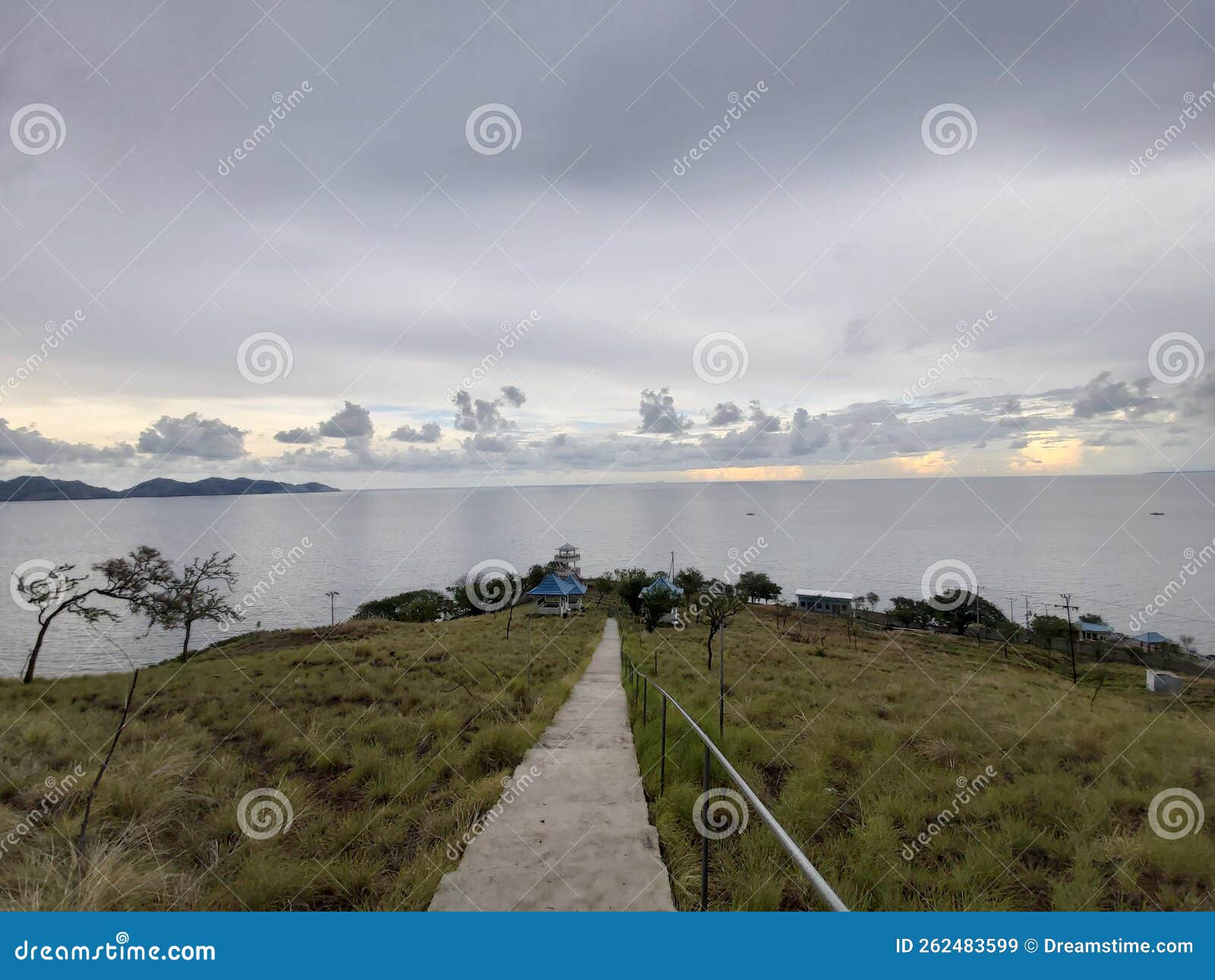 view of the sea and mountains in the evening when the sun sets, the location of sikka flores, indonesia