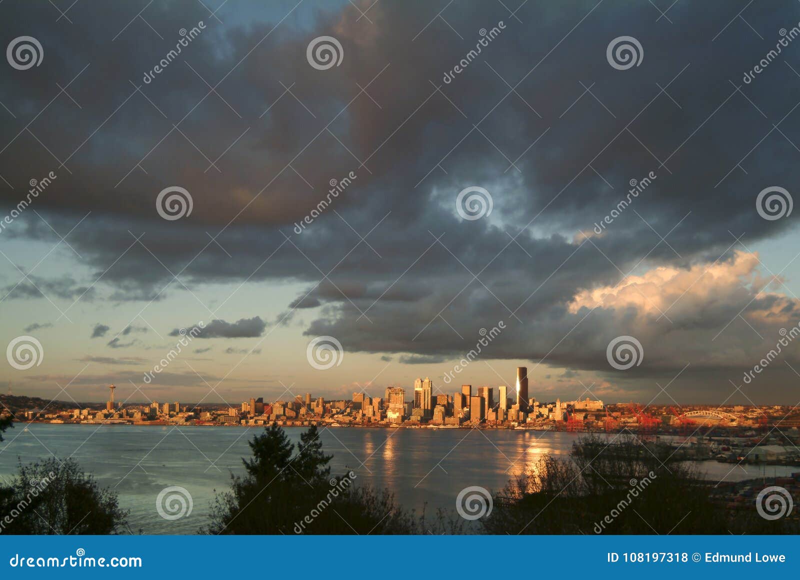 seattle skyline during a dramatic sunset and a rain squall passing through.