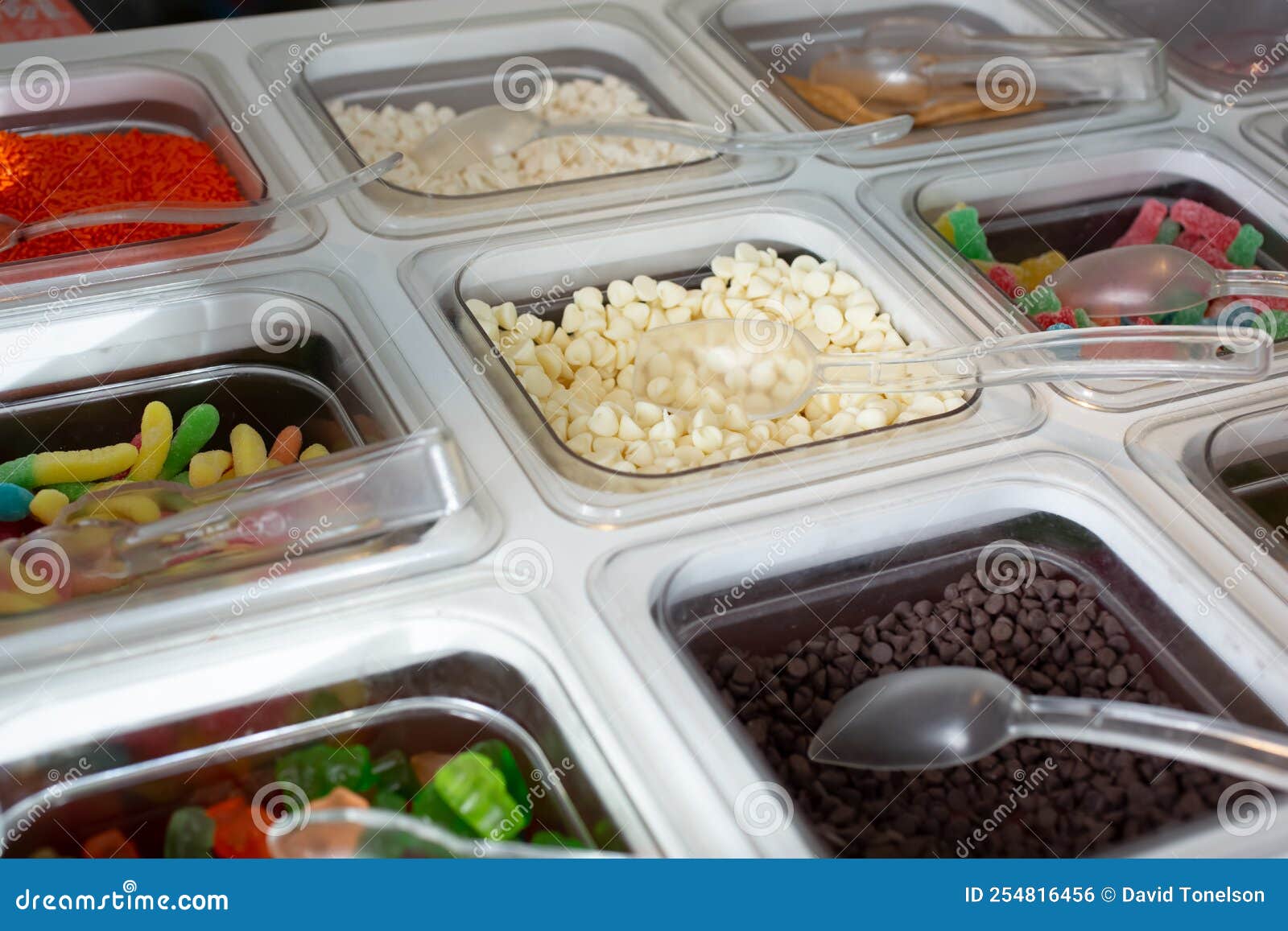 Table of Toppings for Frozen Yogurt or Ice Cream Stock Photo