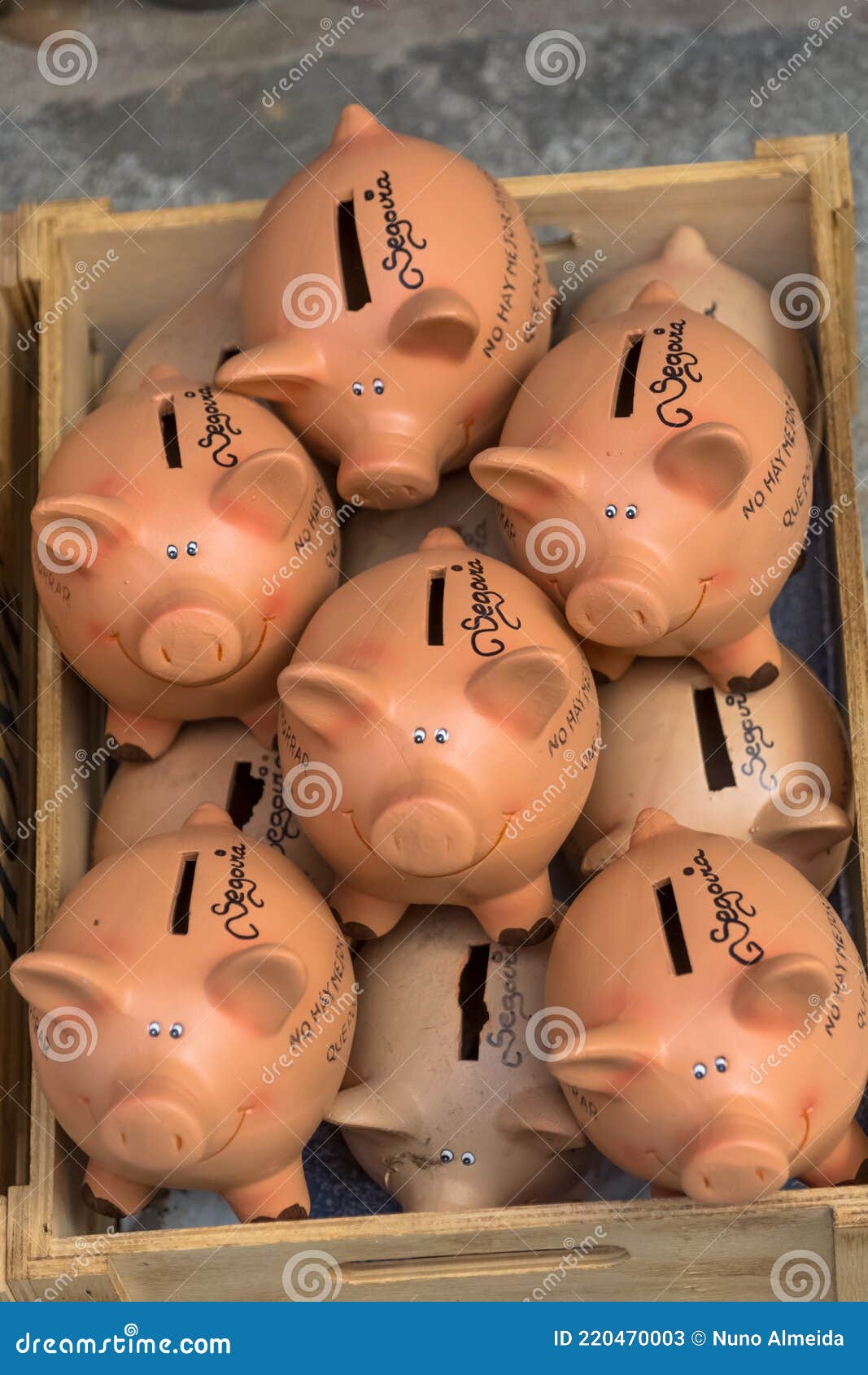 view of several handmade clay pigs, traditional in segovia, for sale in a market