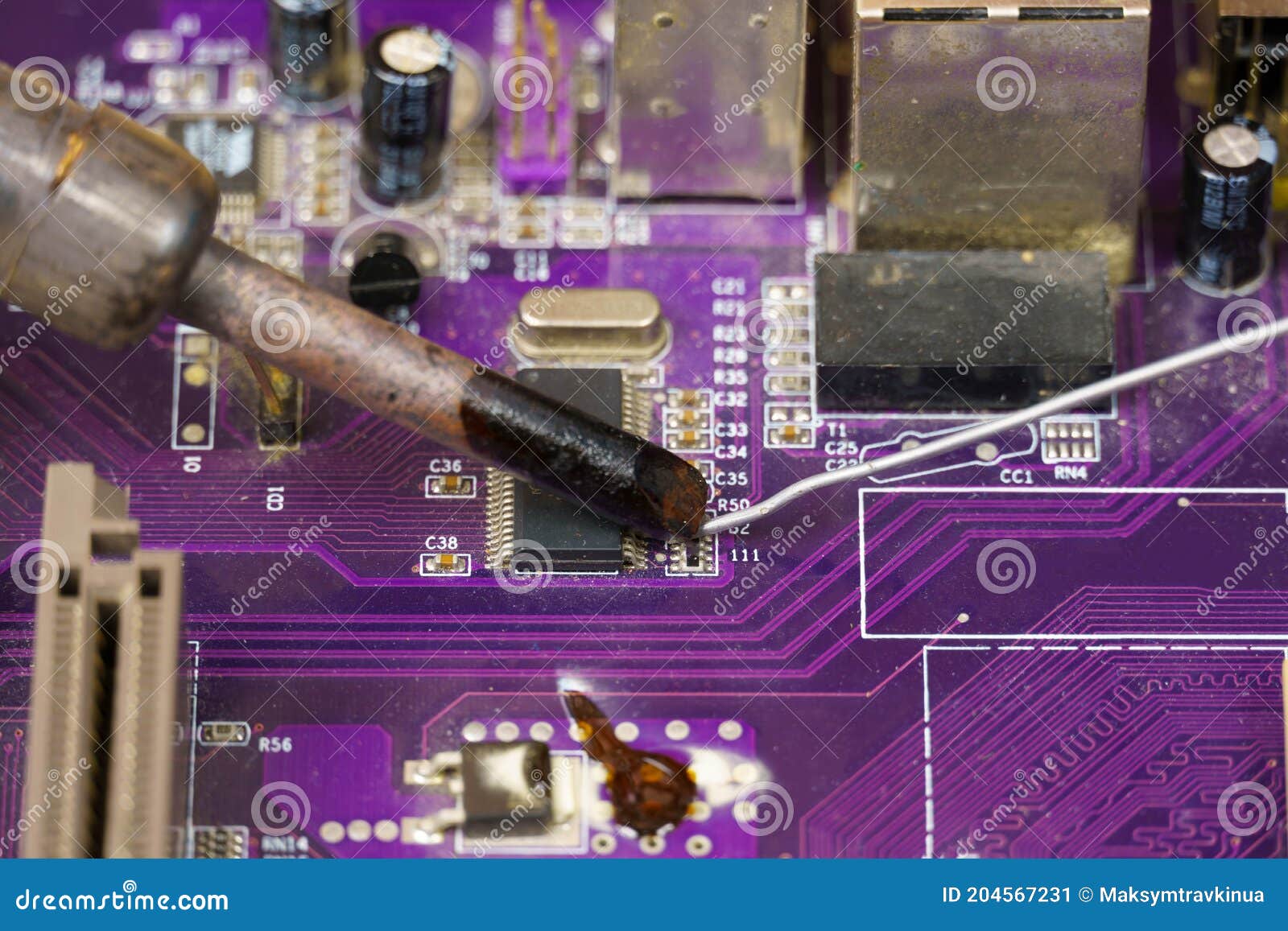A View of the Soldering Iron Tip, Tin, and the Purple Computer
