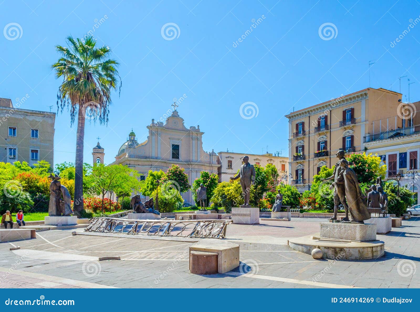 view of statues on piazza umberto giordano in foggia, italy....image