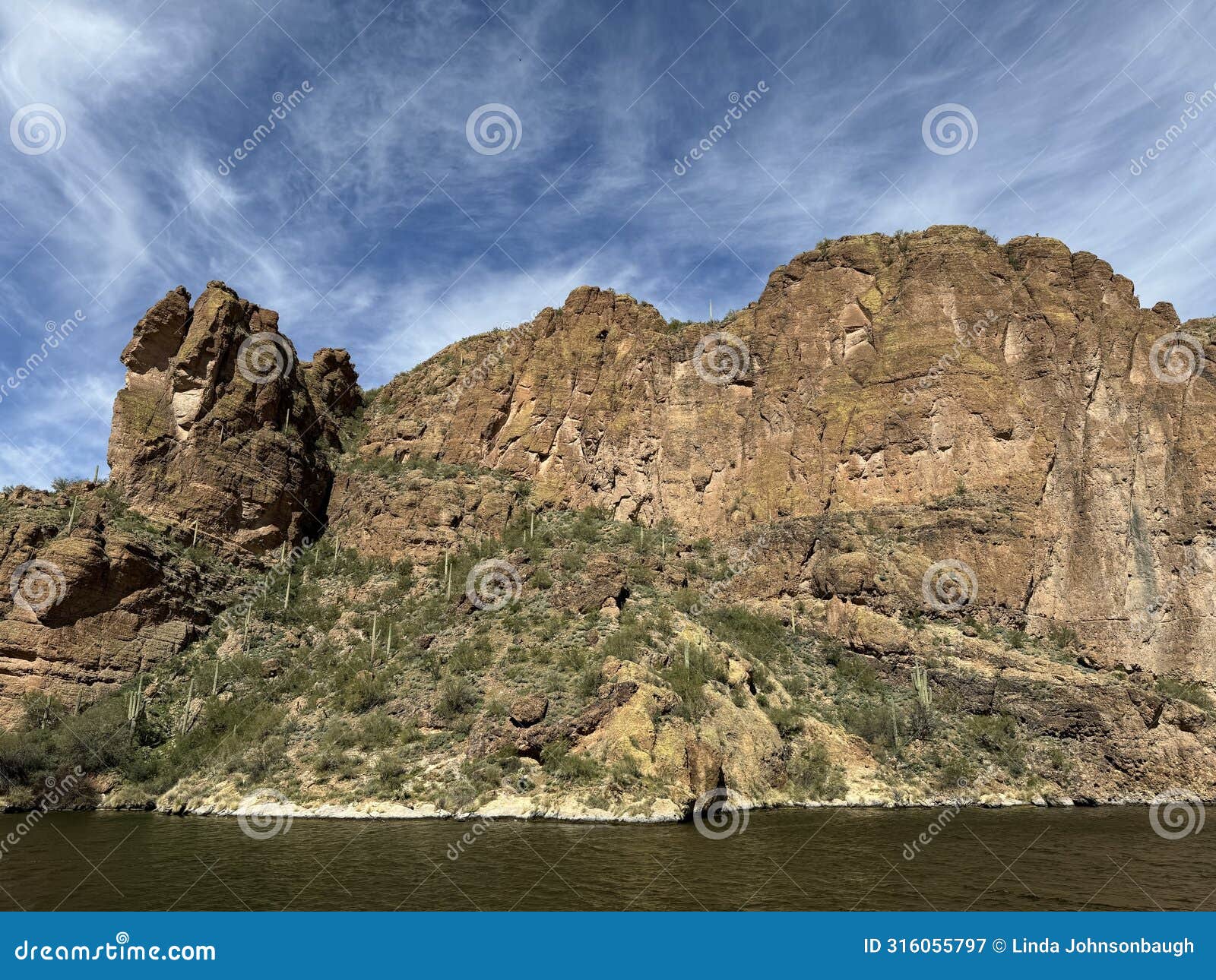 view of canyon lake and rock formations from a steamboat in arizona