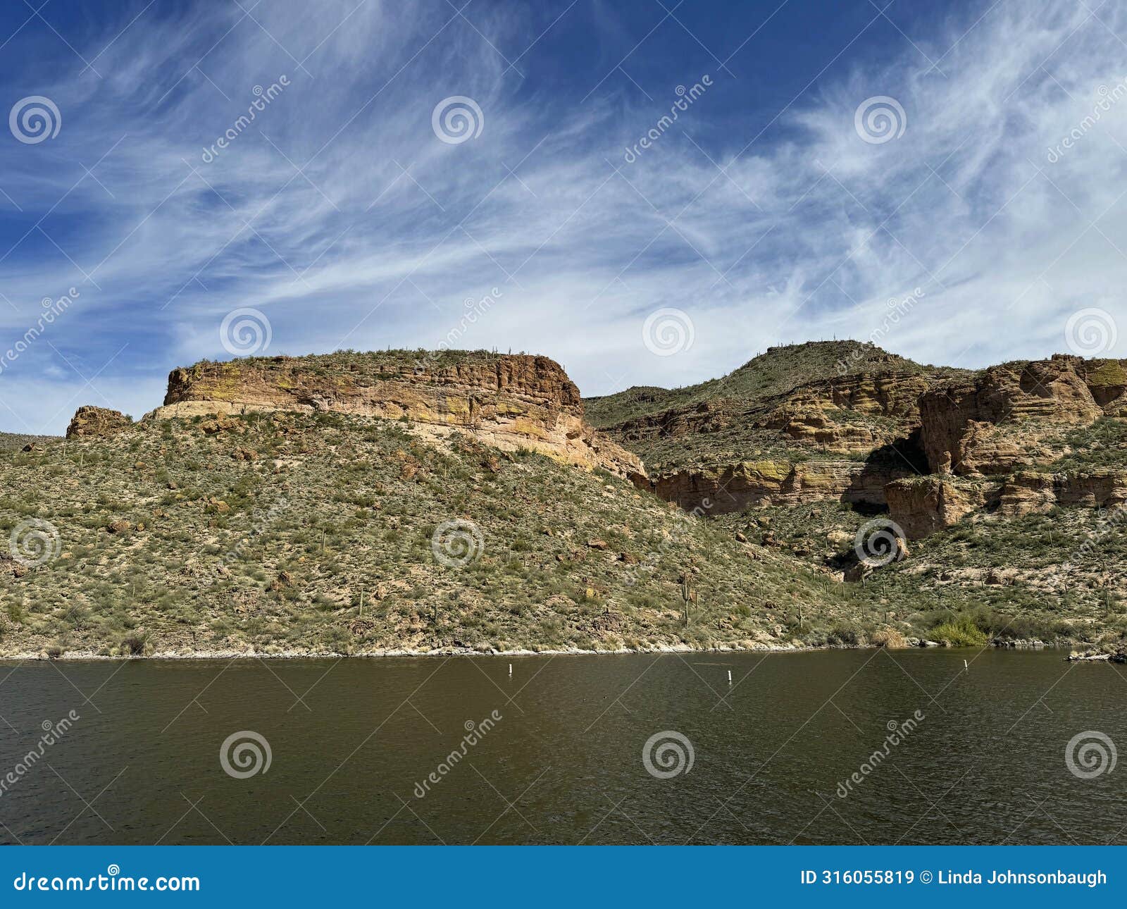 view of canyon lake and rock formations from a steamboat in arizona