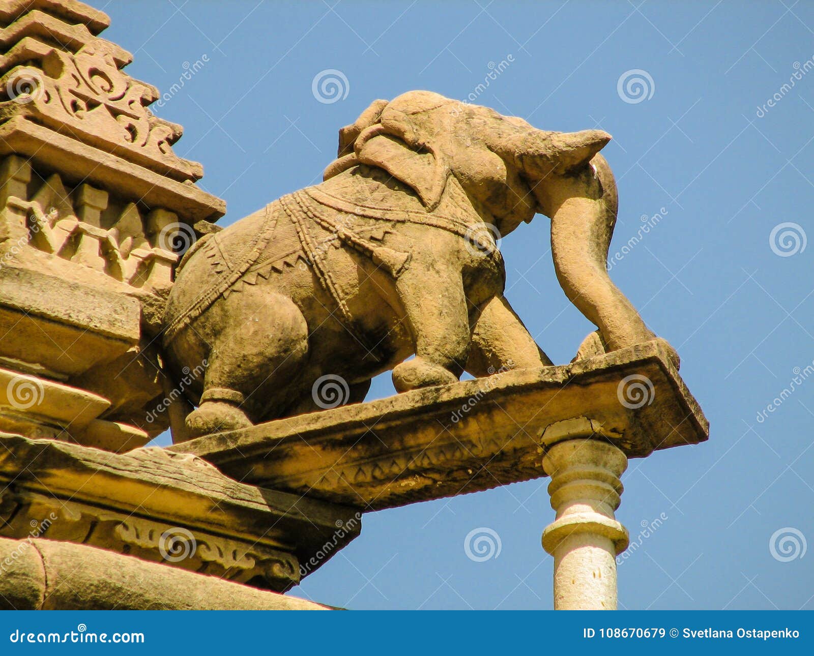 view of a stone sculpture of an elephant on the portico of an indian temple