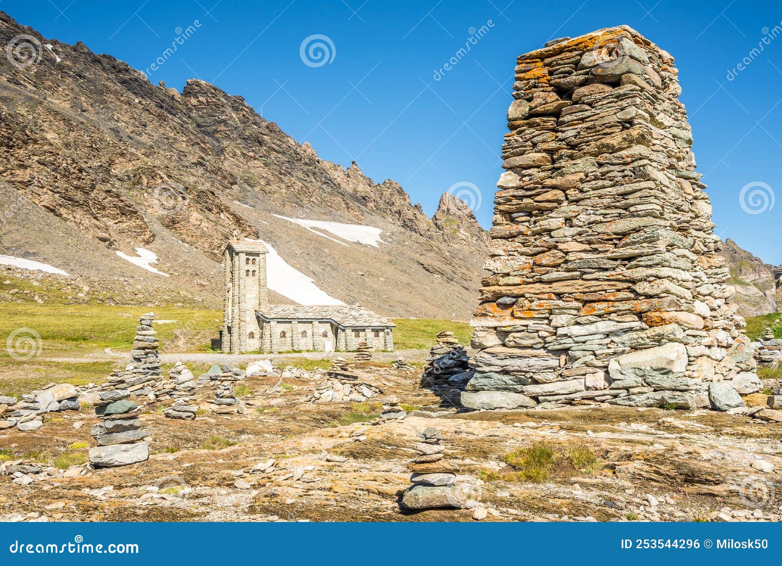 view at stone tower and church of our lady of all prudence at col de l iseran pass in savoie alps - france
