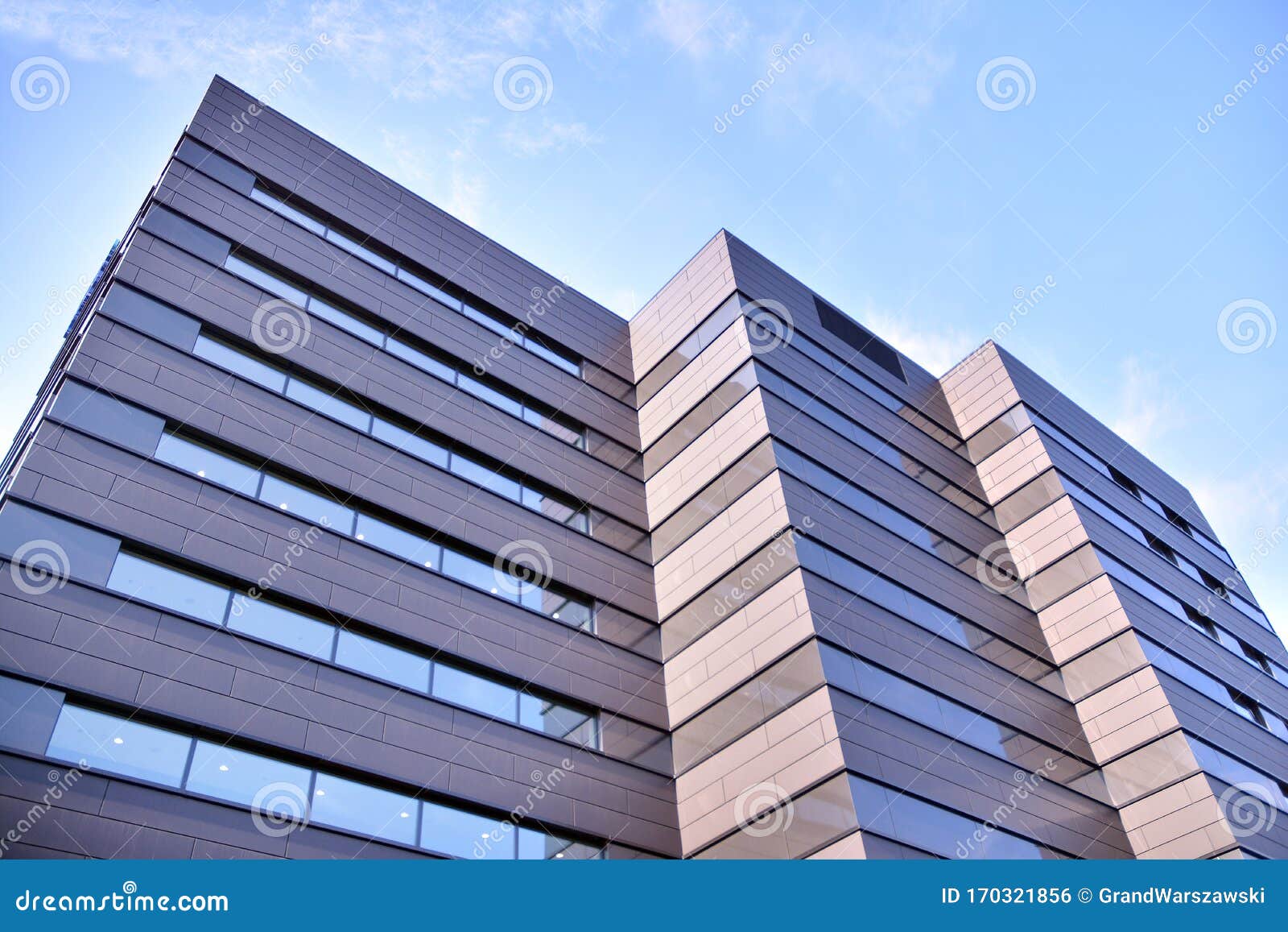 A View at a Straight Facade of a Modern Building with a Dark Grey ...