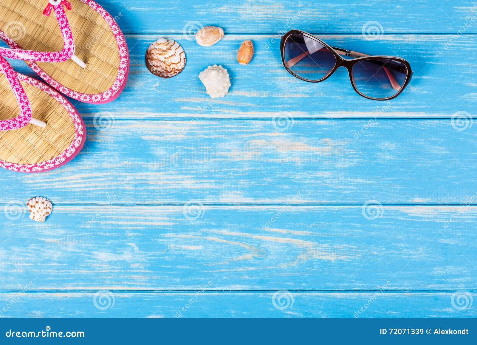 View of Sunglasses Seashells and Flip-flops Lying on Blue Wooden ...