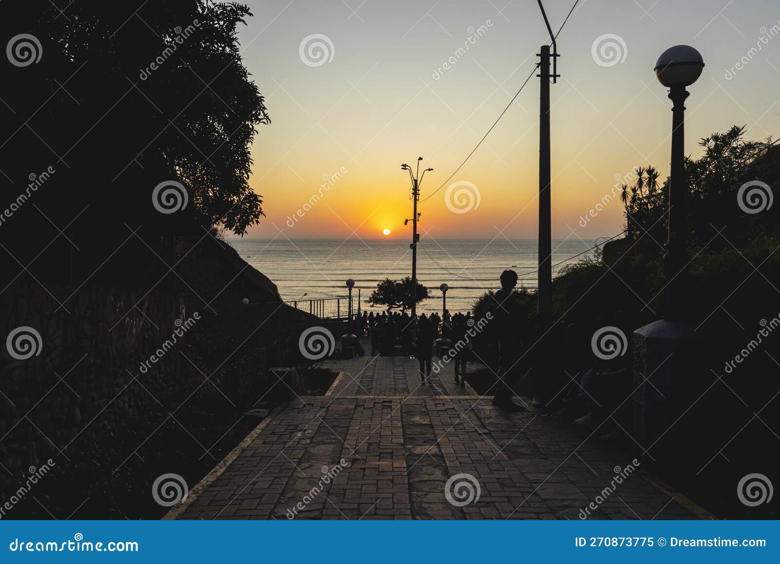 view of the sunset and the beach, from the bajada de baÃ±os, near the beach of barranco, located in barranco, lima - peru