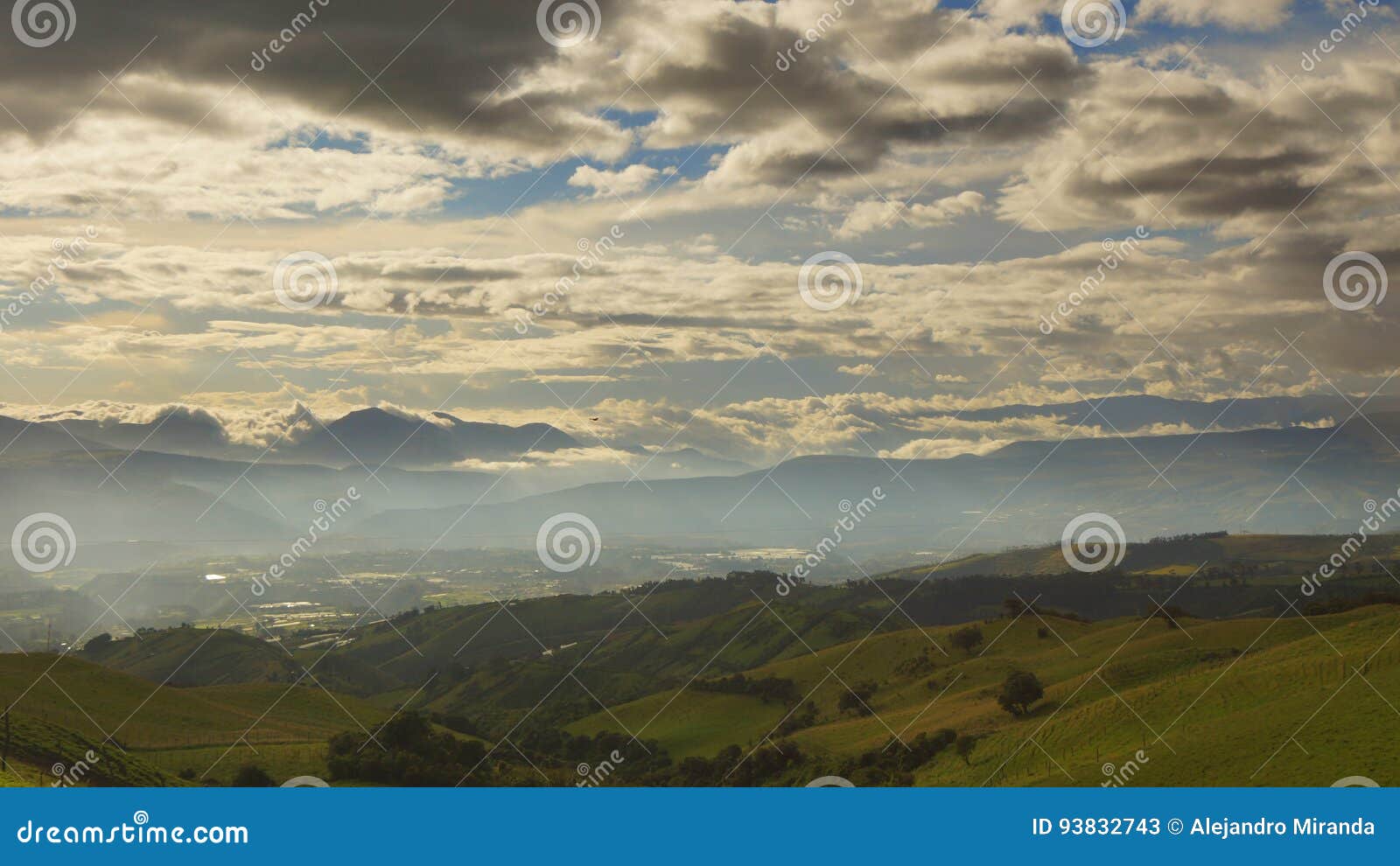 view of a sunset with very cloudy sky over cultivated fields in the area near the village of checa