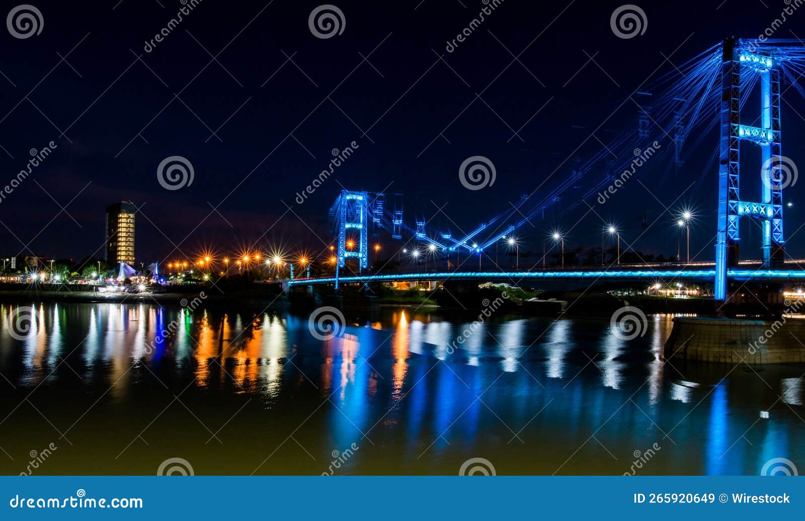 view of the suspended bridge eng. marcial candioti on reflecting bokeh water in argentina