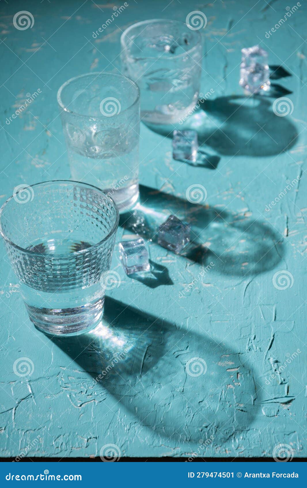 https://thumbs.dreamstime.com/z/view-three-glasses-water-blue-table-shadows-ice-cubes-vertical-copy-space-279474501.jpg