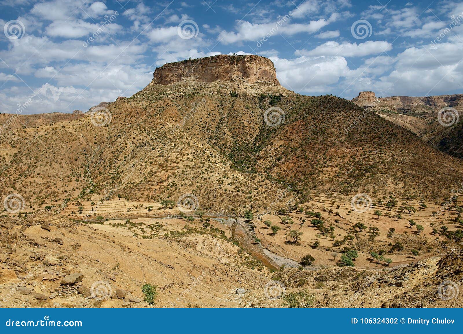 view to the rural surroundings and the hill, on top of which the famous 6-th century ethiopian debre damo monastery is located in