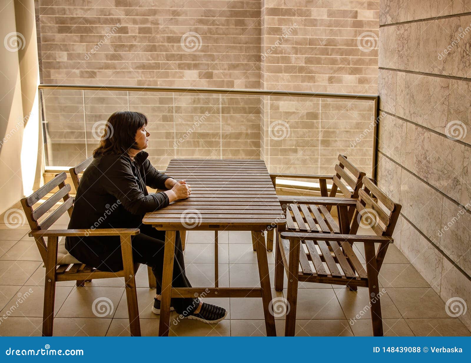 Terrible view from the balcony gives a panic attack of a mature adult woman